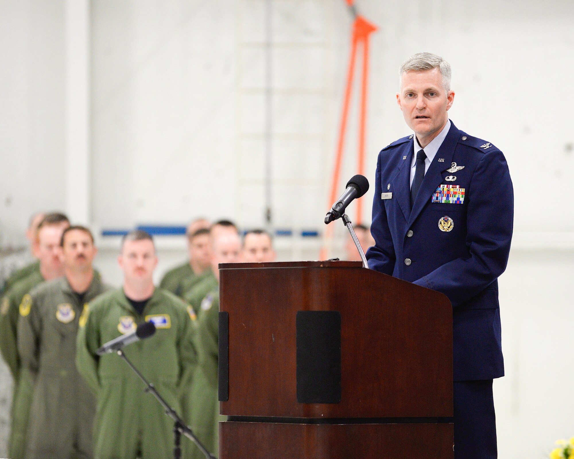 Col. Dave Smith, 582nd Helicopter Group commander, speaks to Airmen and visitors March 27, 2015, during the 582nd HG stand-up and Assumption of Command ceremony on F.E. Warren Air Force Base, Wyo. Smith made history by becoming the commander of the first ever helicopter group in the Air Force. 