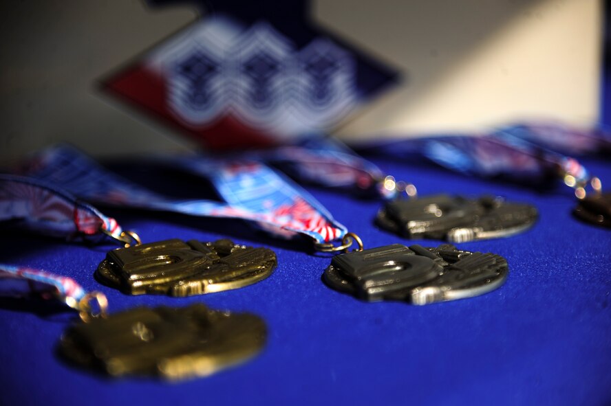 Medals are displayed near the finish line of a 5K Fun Run, April 3, 2015, at Seymour Johnson Air Force Base, North Carolina. The run was held in support of a Team Seymour Airman who suffered debilitating injuries during an accident. (U.S. Air Force photo/Senior Airman Brittain Crolley)