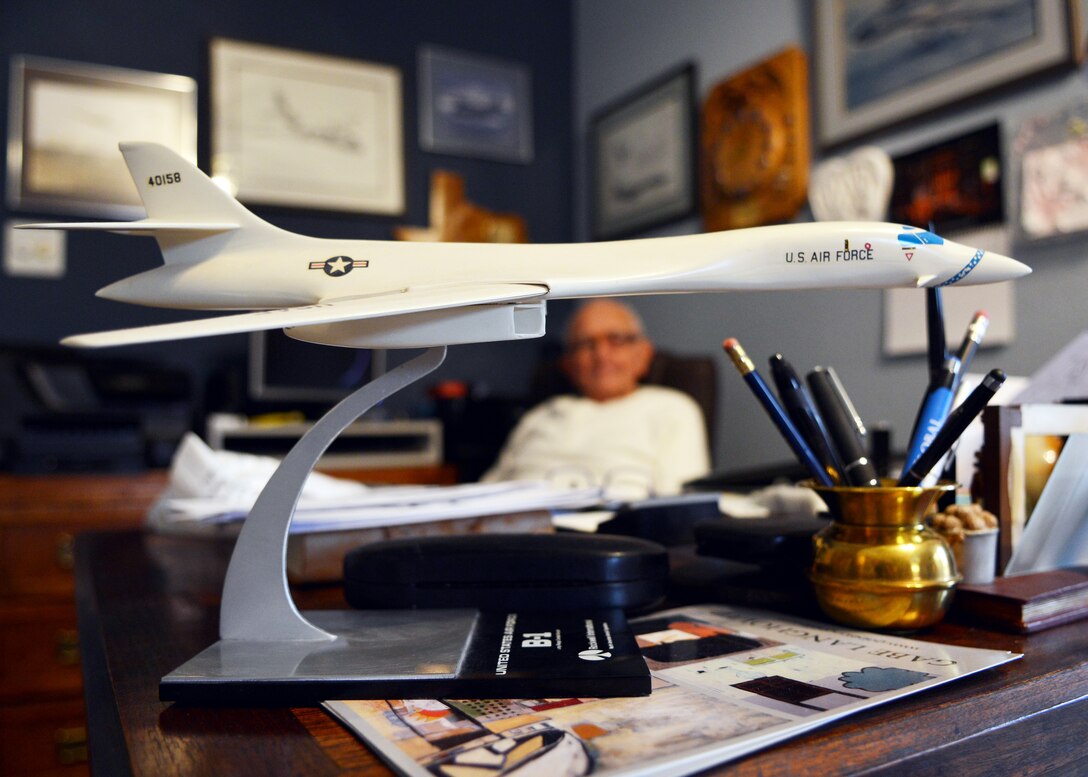 Retired U.S. Air Force Col. Morton Langholtz sits at his desk with a model of the original B-1A March 17, 2015, in Abilene, Texas. Langholtz, the B-1 Site Activation Task Force commander from 1983-1985, was part of the team who helped bring the B-1 to Dyess logistically. (U.S. Air Force photo by Airman 1st Class Kedesha Pennant/Released)