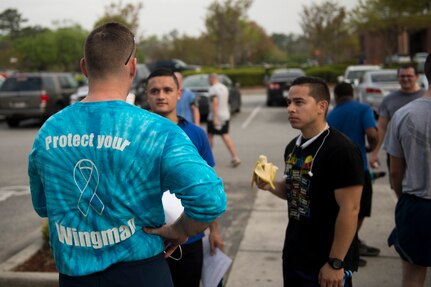 Chief Master Sgt. Mark Bronson, 628th Air Base Wing command chief, talks to participants of the Sexual Assault Awareness Month 5K Walk/Run April 4, 2015, JB Charleston, S.C. The month of April has been declared the official SAAM for JB Charleston with a theme of “Eliminate sexual assault: Know your part. Do your part.” Events will be held throughout the month to help promote awareness. (U.S. Air Force photo / Airman 1st  Class Taylor Queen)