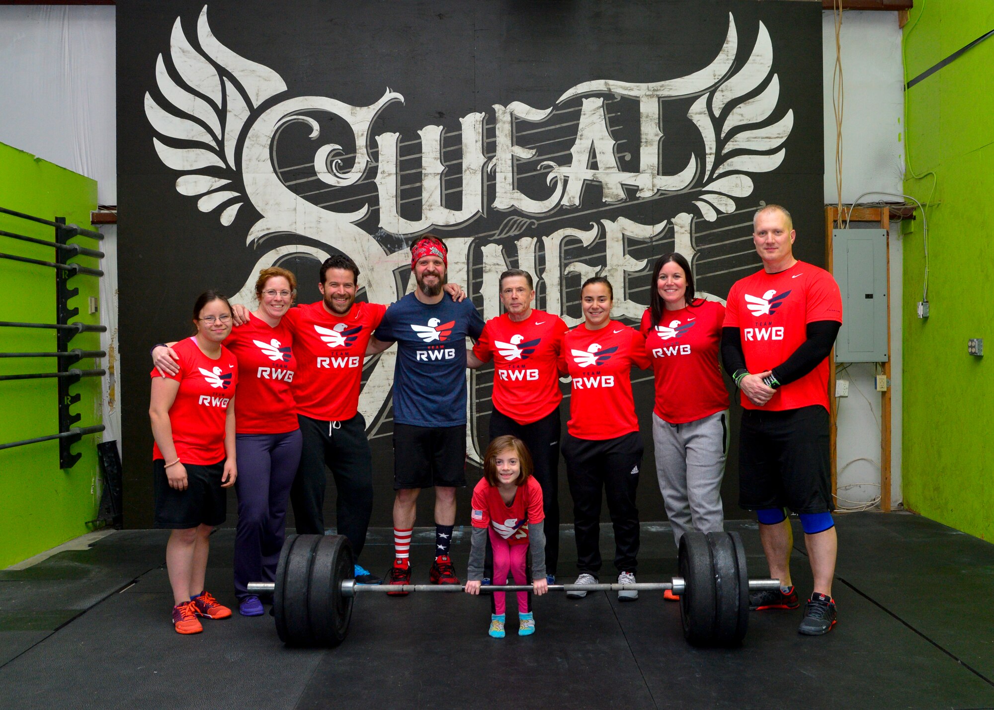 Members of Team Red, White and Blue pose for a group photo following a workout April 2, 2015, at CrossFit Sweat Angel in Camden, Del. Every Thursday members of Team RWB perform high intensity workouts in their RWB shirts, also known as wearing the eagle. (U.S. Air Force photo/Airman 1st Class William Johnson)