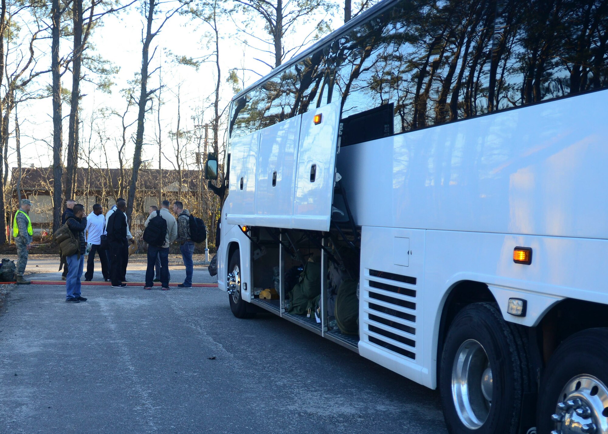 U.S. Air Force Airmen and U.S. Army Soldiers depart the Langley Transit Center at Langley Air Force Base, Va., April 1, 2015. The group underwent a 21-day controlled monitoring period in compliance with Chairman of the Joint Chiefs of Staff Instruction 4220.01, which requires all Department of Defense personnel to remain in a  controlled monitoring areas upon returning from a deployment to, transitioning through, or having been stationed in the Ebola Virus Disease outbreak area in West Africa as declared by the Centers for Disease Control and Prevention or exposed to EVD asymptomatic or symptomatic persons within the continental United States.  (U.S. Air Force photo by  Staff Sgt. Ciara Gosier/Released)