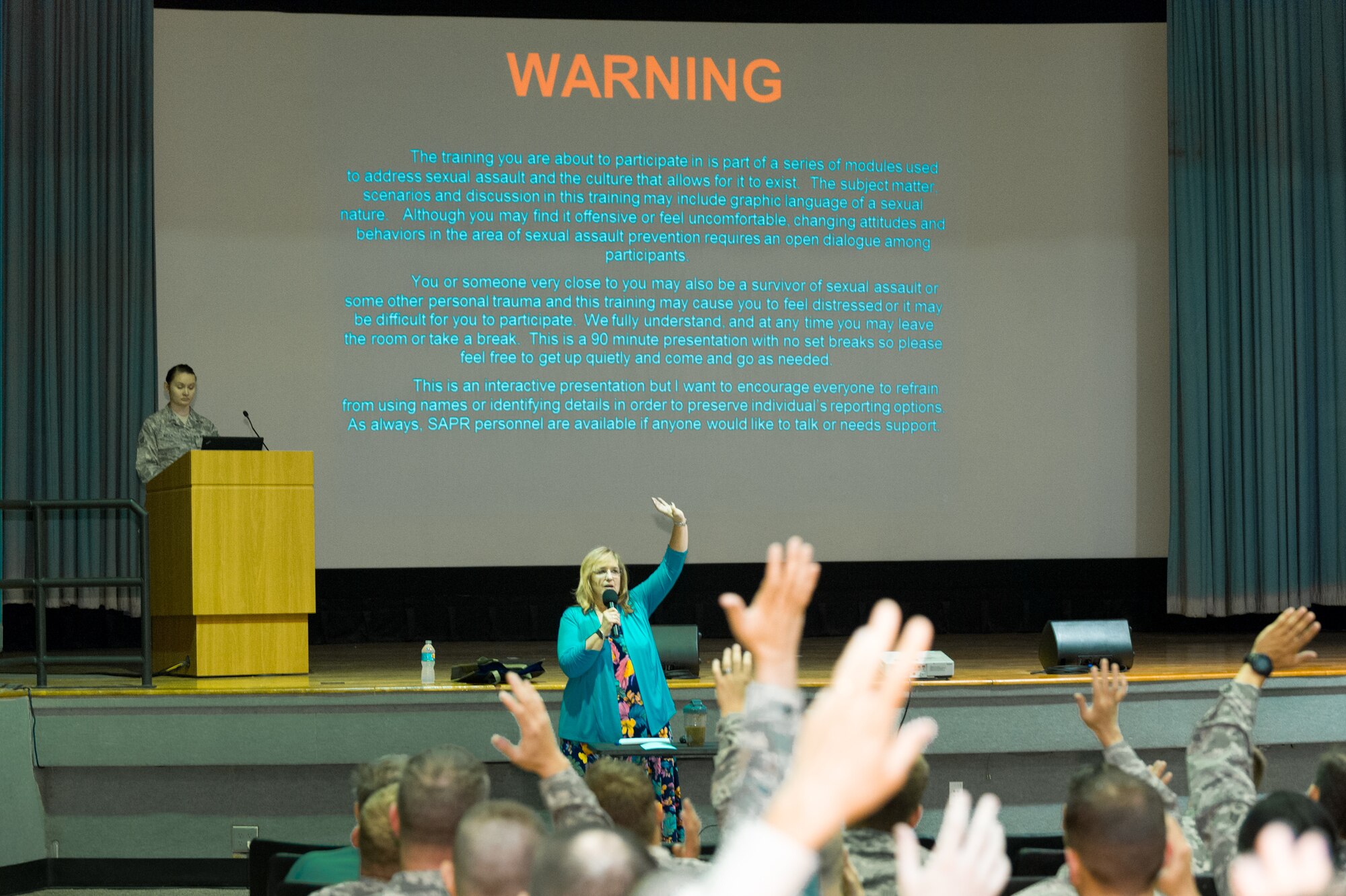 Patricia Gragg, 45th Space Wing Sexual Assault Response Coordinator, kicks off a Sexual Assault Prevention and Response training session at the Patrick Air Force Base Theater, Fla., April 7, 2015. (U.S. Air Force photo/Cory Long) (Released)
