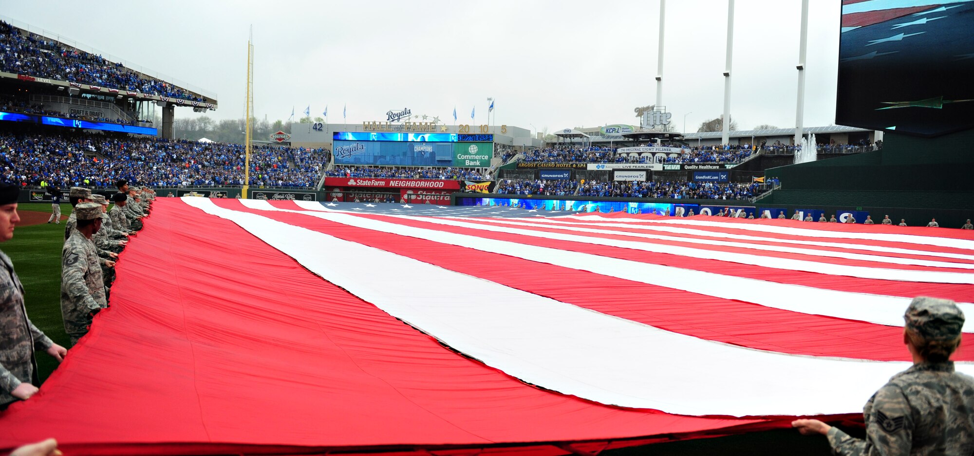 Airmen from Whiteman Air Force Base, Mo. perform a flag detail during the Kansas City Royals opening day game at Kauffman Stadium April 6, 2015. The Royals would go on to defeat the Chicago White Sox with a score of 10-1. (U.S. Air Force photo by Airman 1st Class Joel Pfiester/Released)