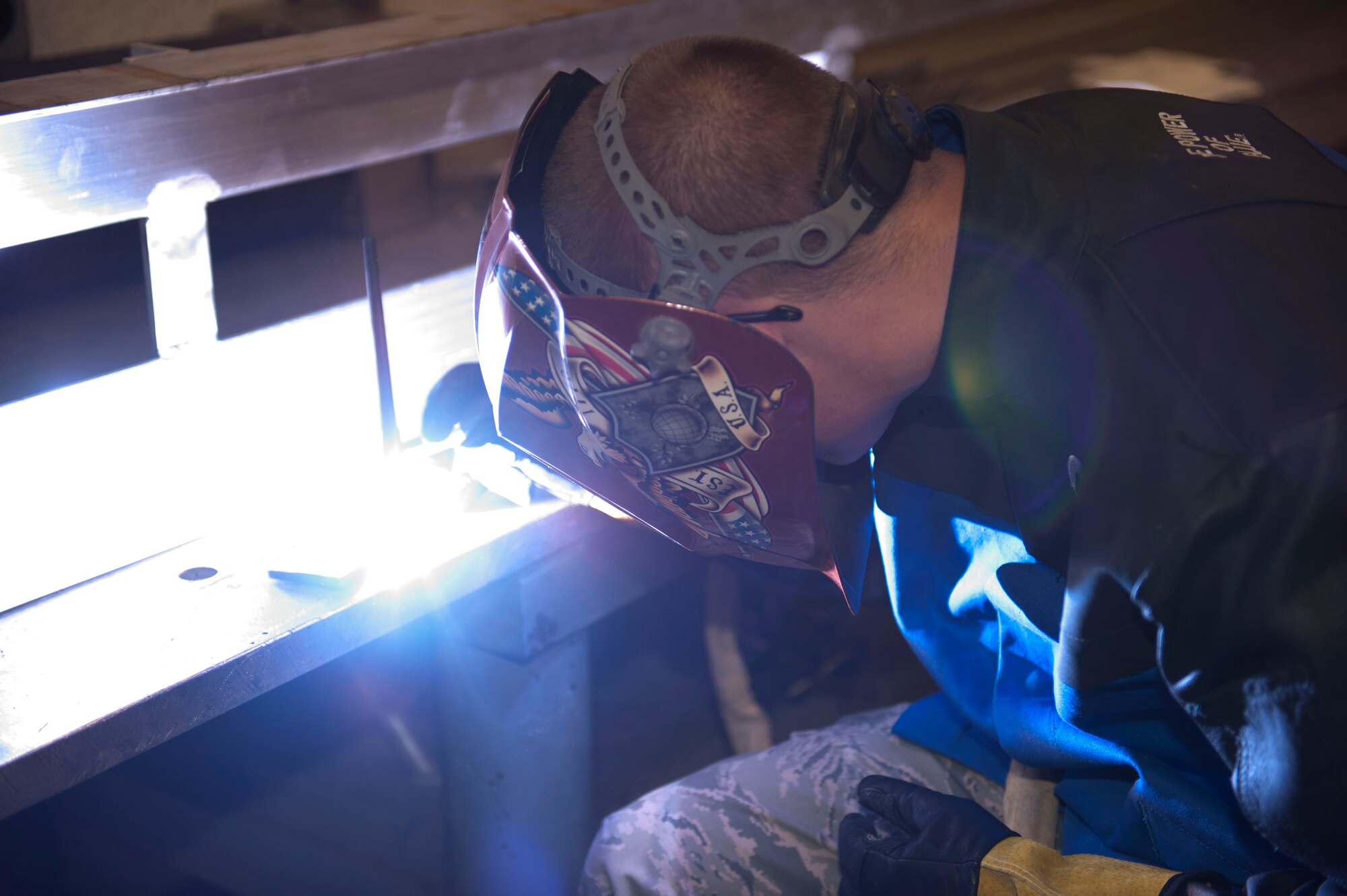 Airman 1st Class Brandon Gordon, 49th Maintenance Squadron Aircraft Metals Technology apprentice, welds together a pod dolly at Holloman Air Force Base, N.M. April 6, 2015. Gordon used a gas tungsten arc process to complete the welds on the pod dolly. (U.S. Air Force photo by Staff Sgt. E’Lysia A. Wray/Released)