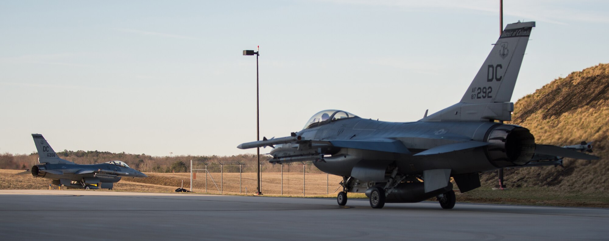 Two Washington, D.C., Air National Guard F-16 Fighting Falcons roll towards the flightline for during a simulated alert mission at the 113th Fighter Wing’s Aerospace Control Alert Detachment, Joint Base Andrews, Md., March 30, 2015. The alert unit was created in response to the September 11, terrorist attack on the United States in 2001. (U.S. Air Force photo/Airman 1st Class Philip Bryant)