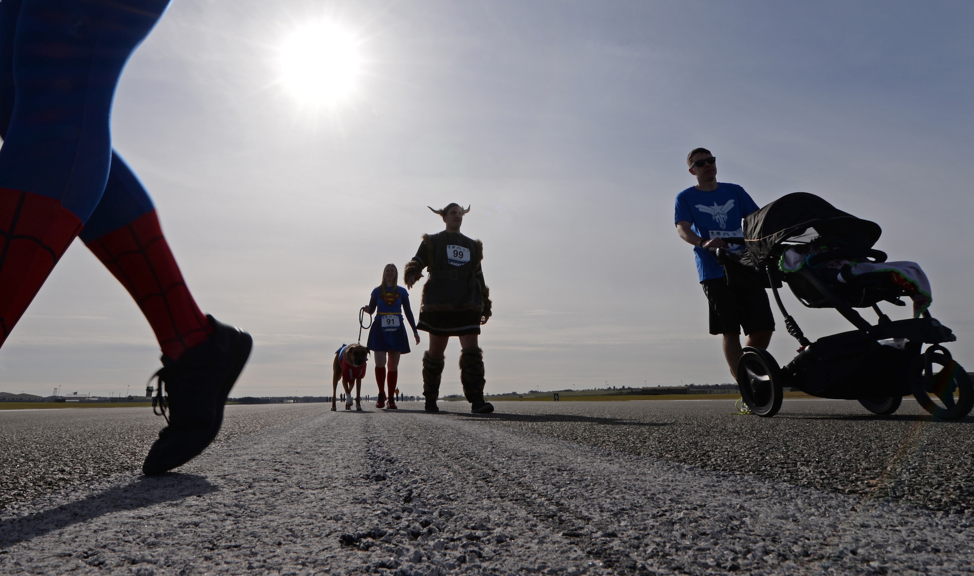 Staff Sgt. Daniel Garrett, 48th Civil Engineer Squadron explosive ordnance disposal technician, walks with his wife, Christine, and their dog during a 5K memorial run in memory of Tech. Sgt. Phillip Myers, an EOD craftsman, at Royal Air Force Lakenheath, England, April 2, 2015. Myers gave his life in the line of duty while deployed to Afghanistan April 4, 2009. (U.S. Air Force photo by Airman 1st Class Erin R. Babis/Released)