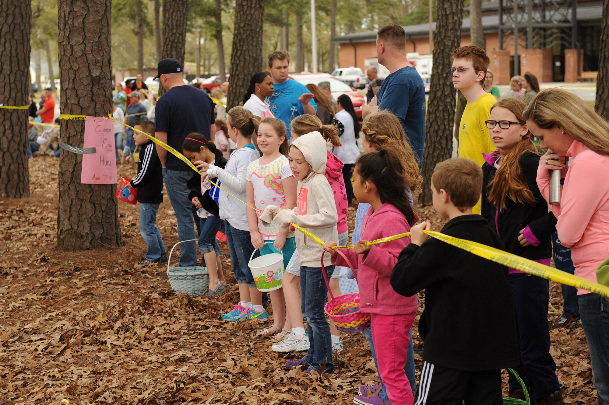 Children prepare to hunt for eggs as part of the Month of the Military child kickoff event April 4, 2015, at Seymour Johnson Air Force Base, North Carolina. More than 400 children participated in the activities that are held annually to promote family togetherness. (U.S. Air Force photo/Airman 1st Class Aaron J. Jenne)
