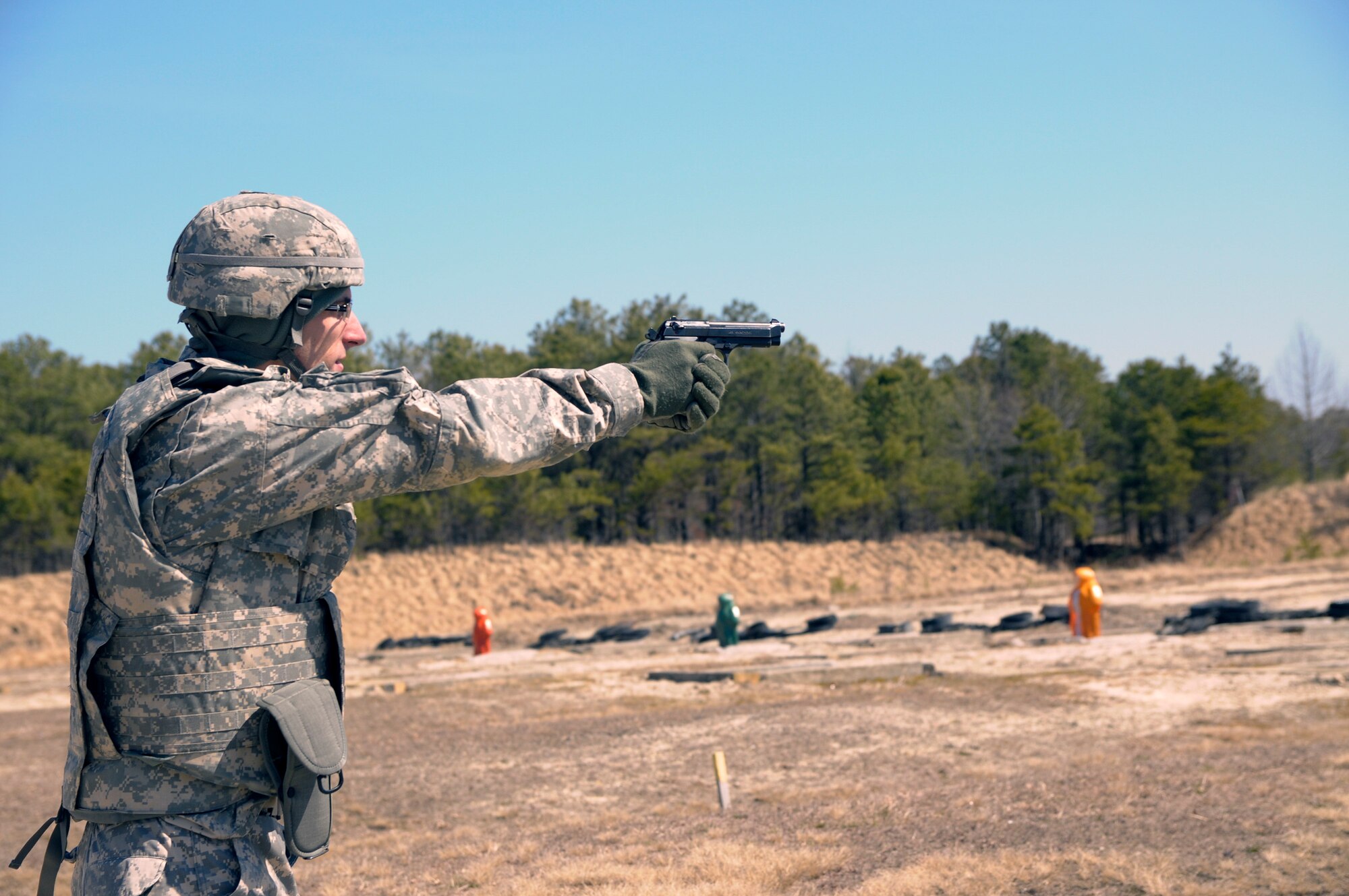 Army Reserve Spc. Jared Blue, 22, from Marion, Ind., fires the M9 pistol during day three of the 200th Military Police Command???s Best Warrior Competition on April 2 at Joint Base McGuire-Dix-Lakehurst, N.J. Eight warfighters are competing in the weeklong competition held March 31 - April 3 in a variety of physical and mental events to earn the top spot of Best Warrior for Soldier and noncommissioned officer of the year. Blue is an intelligence Analyst assigned to the Headquarters and Headquarters Company, 384th MP Battalion. The winners will compete at the Army Reserve Best Warrior Competition held in May. The 200th MPCOM is the largest Department of Defense law enforcement organization with nearly 14,000 Soldiers living in 44 states. (Army Reserve photo by Sgt. Gina Russell/released)