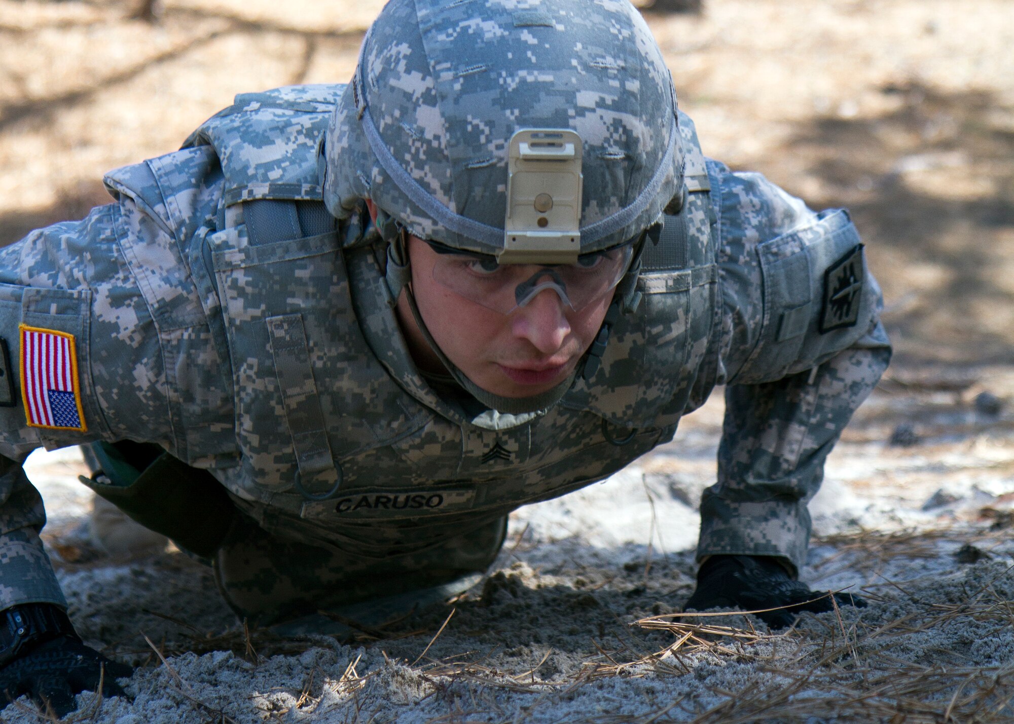Army Reserve Sgt. Rob Caruso, from Atco, New Jersey, prepares to rush during the reflexive fire exercise during day three of the 200th Military Police Command???s Best Warrior Competition on April 2 at Joint Base McGuire-Dix-Lakehurst, N.J. Eight warfighters are competing in the weeklong competition held March 31-April 3 in a variety of physical and mental events to earn the top spot of Best Warrior for Soldier and noncommissioned officer of the year. Caruso is a Corrections Specialist assigned to 367th Military Police Company. The winners will compete at the Army Reserve Best Warrior Competition held in May. The 200th MPCOM is the largest Department of Defense law enforcement organization with nearly 14,000 Soldiers living in 44 states. (Army Reserve photo by Sgt. 1st Class Mark Bell/released)