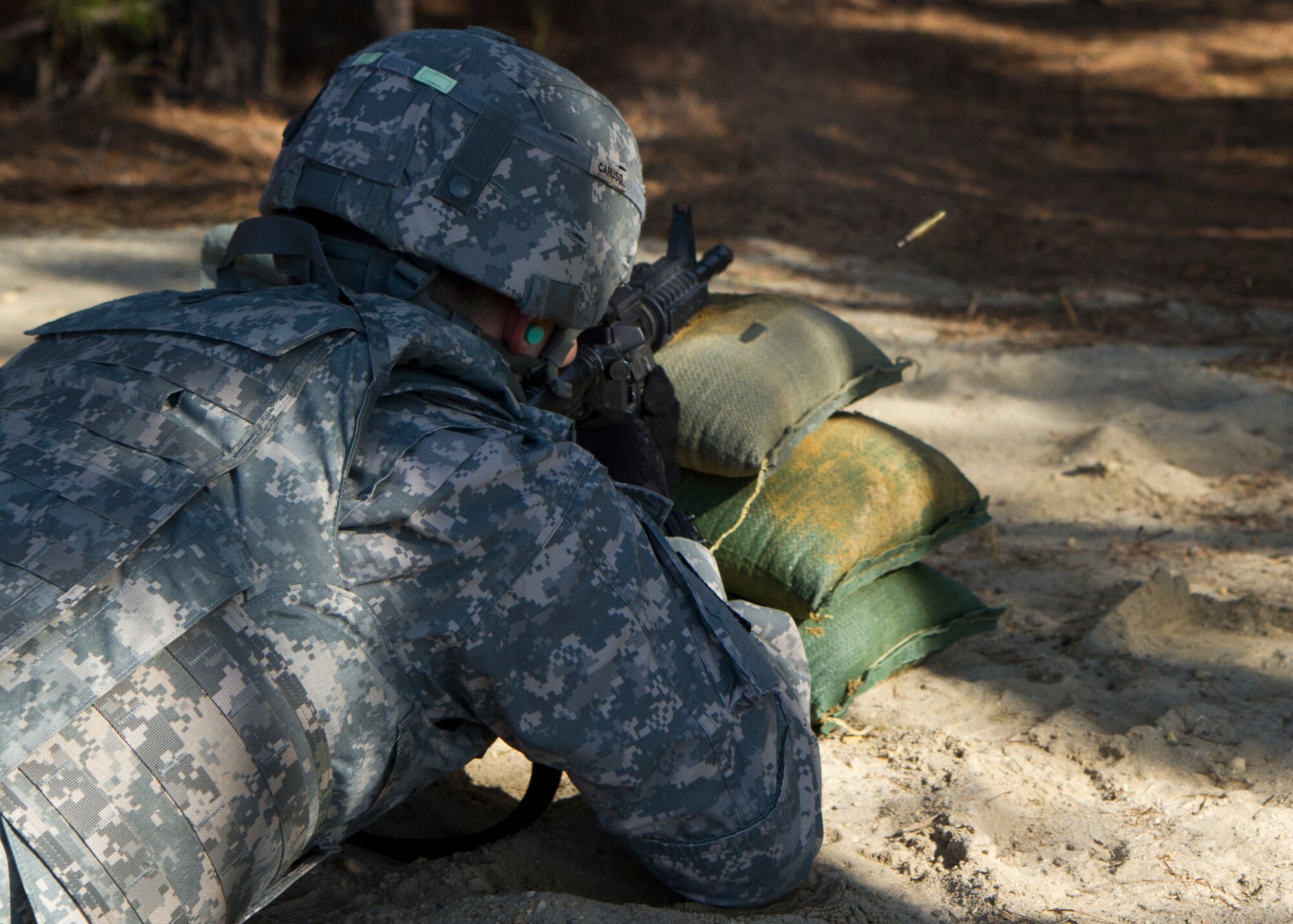 Army Reserve Sgt. Rob Caruso, from Atco, New Jersey, fires his M4 Carbine during the weapon qualification during day three of the 200th Military Police Command???s Best Warrior Competition on April 2 at Joint Base McGuire-Dix-Lakehurst, N.J. Eight warfighters are competing in the weeklong competition held March 31-April 3 in a variety of physical and mental events to earn the top spot of Best Warrior for Soldier and noncommissioned officer of the year. Caruso is a Corrections Specialist assigned to 367th Military Police Company. The winners will compete at the Army Reserve Best Warrior Competition held in May. The 200th MPCOM is the largest Department of Defense law enforcement organization with nearly 14,000 Soldiers living in 44 states. (Army Reserve photo by Sgt. 1st Class Mark Bell/released)