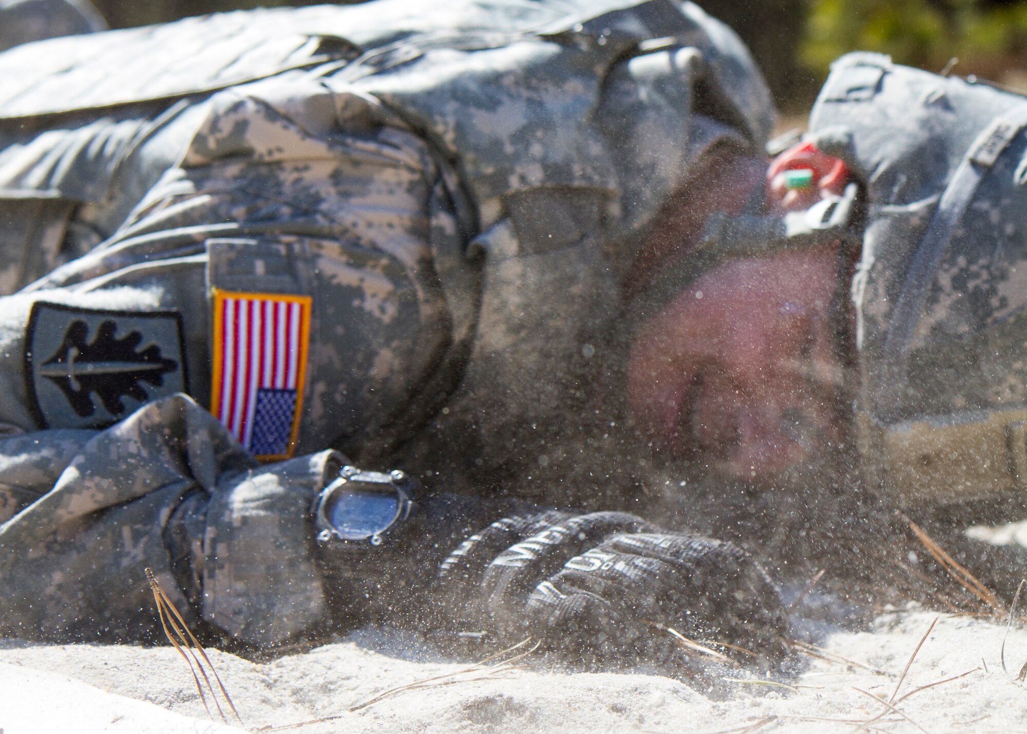 Army Reserve Sgt. Rob Caruso, from Atco, N.J., low crawls during the reflexive fire exercise during day three of the 200th Military Police Command???s Best Warrior Competition on April 2 at Joint Base McGuire-Dix-Lakehurst, N.J. Eight warfighters are competing in the weeklong competition held March 31 ??? April 3 in a variety of physical and mental events to earn the top spot of Best Warrior for Soldier and noncommissioned officer of the year. Caruso is a corrections specialist assigned to 367th Military Police Company. The winners will compete at the Army Reserve Best Warrior Competition held in May. The 200th MPCOM is the largest Department of Defense law enforcement organization, with nearly 14,000 Soldiers living in 44 states. (Army Reserve photo by Sgt. 1st Class Mark Bell/released)