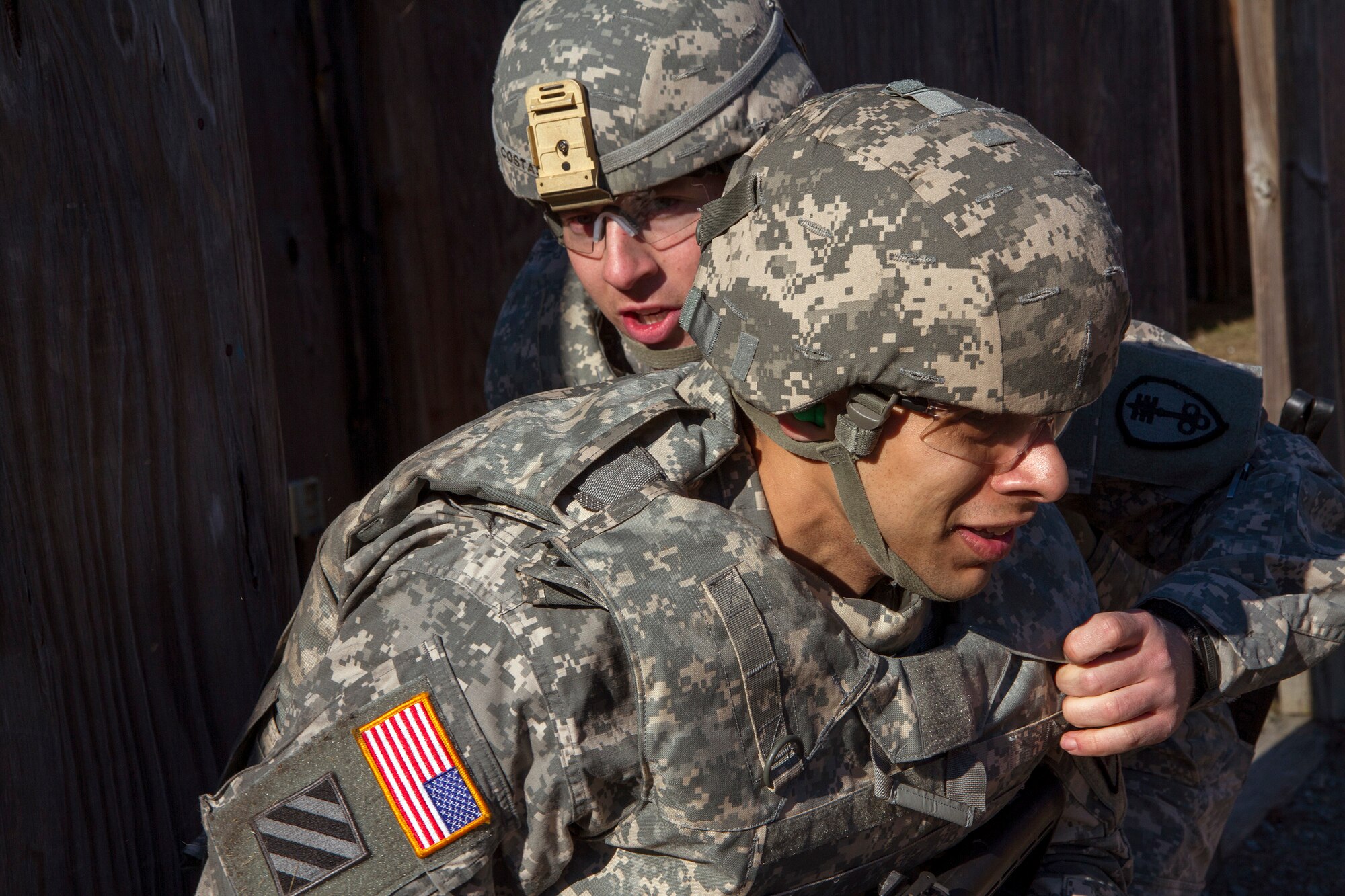 Army Reserve Staff Sgt. Jacob Costas (top), 28, from DeWitt, Iowa, and Sgt. Juan Rivera, 31, from Bronx, N.Y. work their way through a scenario-based Army Warrior Task exercise during day two of the 200th Military Police Command???s Best Warrior Competition on April 2 at Joint Base McGuire-Dix-Lakehurst, N.J.. Eight warfighters are competing in the weeklong competition held March 31 - April 3 in a variety of physical and mental events to earn the top spot of Best Warrior for Soldier and noncommissioned officer of the year. Costas is a Military Police Soldier assigned to the 339th MP Company. Rivera is a Military Police Soldier assigned to the 340th MP Company. The winners will compete at the Army Reserve Best Warrior Competition held in May. The 200th MPCOM is the largest Department of Defense law enforcement organization with nearly 14,000 Soldiers living in 44 states. (Army Reserve photo by Sgt. 1st Class Mark Bell/released)