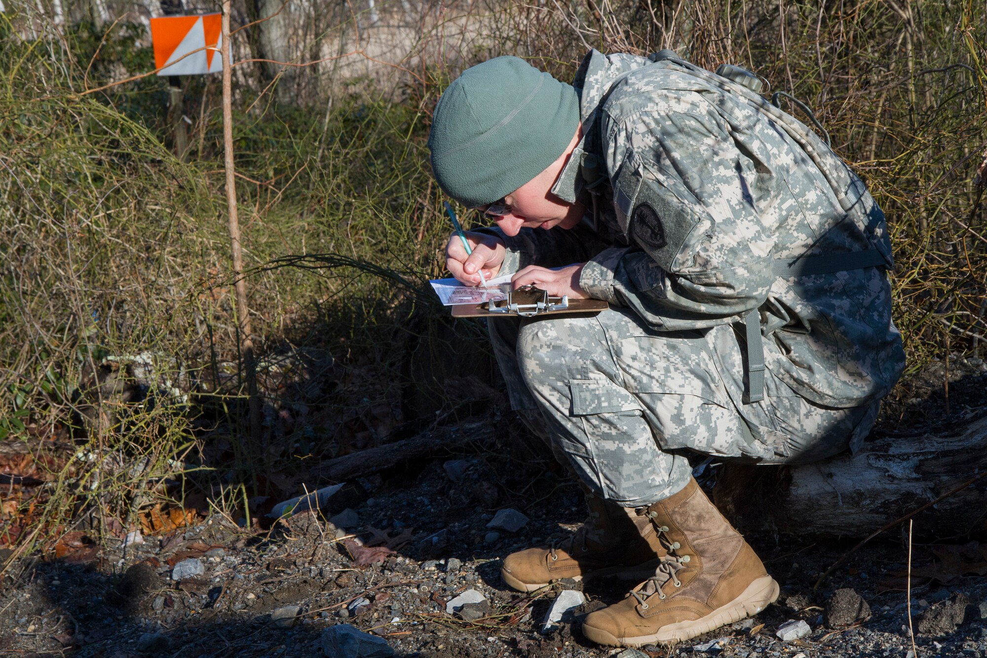 Army Reserve Staff Sgt. Jacob Costas, 28, from DeWitt, Iowa, plots his distance points at the daytime navigation course during day two of the 200th Military Police Command???s Best Warrior Competition on March 31 at Joint Base McGuire-Dix-Lakehurst, N.J. Eight warfighters are competing in the weeklong competition held March 31-April 3 in a variety of physical and mental events to earn the top spot of Best Warrior for Soldier and noncommissioned officer of the year. Costas is a Military Police Soldier assigned to the 339th MP Company. The winners will compete at the Army Reserve Best Warrior Competition held in May. The 200th MPCOM is the largest Department of Defense law enforcement organization with nearly 14,000 Soldiers living in 44 states. (Army Reserve photo by Sgt. 1st Class Mark Bell/released)