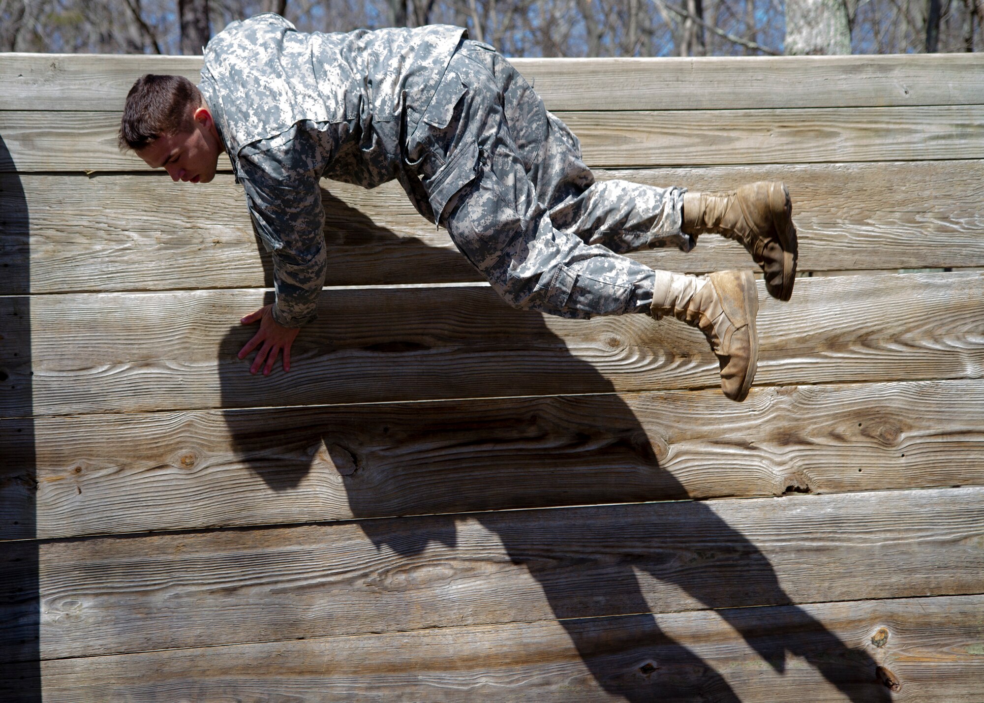 Army Reserve Spc. Kyle Coder, 20, from Murfreesboro, Tenn., completes an obstacle course event during day two of the 200th Military Police Command???s Best Warrior Competition on April 1 at Joint Base McGuire-Dix-Lakehurst, N.J. Eight warfighters are competing in the weeklong competition held March 31 ??? April 3 in a variety of physical and mental events to earn the top spot of Best Warrior for Soldier and noncommissioned officer of the year. Coder is a Military Police Soldier assigned to the 450th MP Company. The winners will compete at the Army Reserve Best Warrior Competition held in May. The 200th MPCOM is the largest Department of Defense law enforcement organization, with nearly 14,000 Soldiers living in 44 states. (Army Reserve photo by Sgt. 1st Class Mark Bell/released)