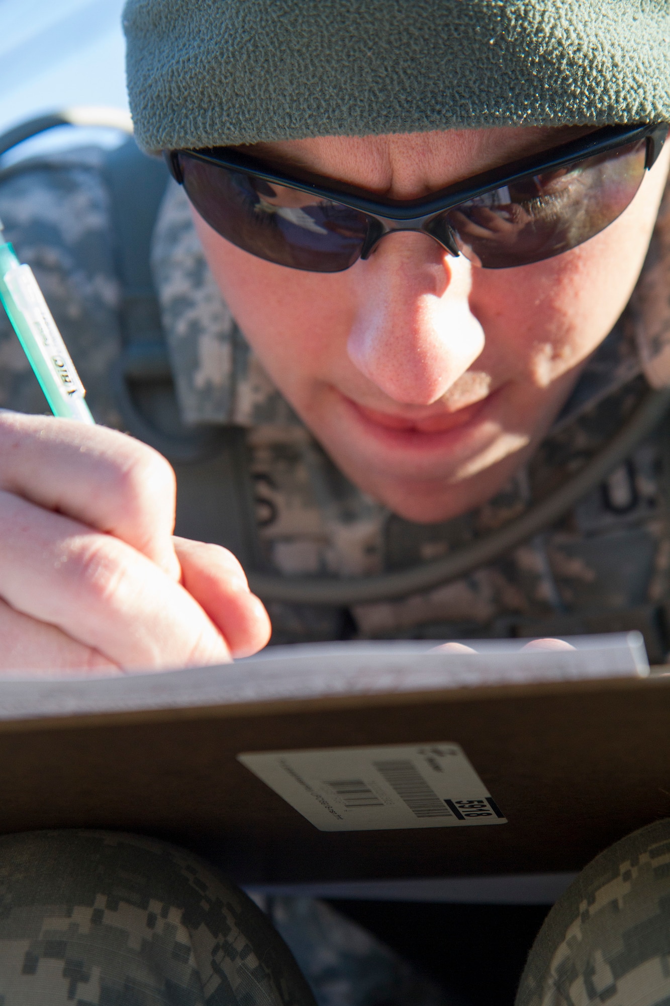 Army Reserve Spc. Chance Humbard, 21, from Waldorf, Maryland, plots his distance points at the daytime navigation course during day two of the 200th Military Police Command???s Best Warrior Competition on March 31 at Joint Base McGuire-Dix-Lakehurst, N.J. Eight warfighters are competing in the weeklong competition held March 31-April 3 in a variety of physical and mental events to earn the top spot of Best Warrior for Soldier and noncommissioned officer of the year. Humbard is supply specialist assigned to Headquarters and Headquarters Company, 400th Military Police Battalion, based at Fort Meade, Maryland. The winners will compete at the Army Reserve Best Warrior Competition held in May. The 200th MPCOM is the largest Department of Defense law enforcement organization with nearly 14,000 Soldiers living in 44 states. (Army Reserve photo by Sgt. 1st Class Mark Bell/released)