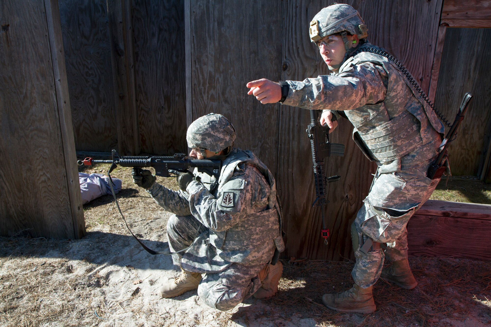 Army Reserve Spc. Michael Goff, 23, a Military Police Soldier, works his way through a scenario-based Army Warrior Task exercise during day two of the 200th Military Police Command???s Best Warrior Competition on April 2 at Joint Base McGuire-Dix-Lakehurst, N.J. Eight warfighters are competing in the week-long competition held March 31-April 3 in a variety of physical and mental events to earn the top spot of Best Warrior for Soldier and noncommissioned officer of the year. Goff is assigned to the 366th MP Company and from Dallas, Texas. The winners will compete at the Army Reserve Best Warrior Competition held in May. The 200th MPCOM is the largest Department of Defense law enforcement organization with nearly 14,000 Soldiers living in 44 states. (Army Reserve photo by Sgt. 1st Class Mark Bell/released)