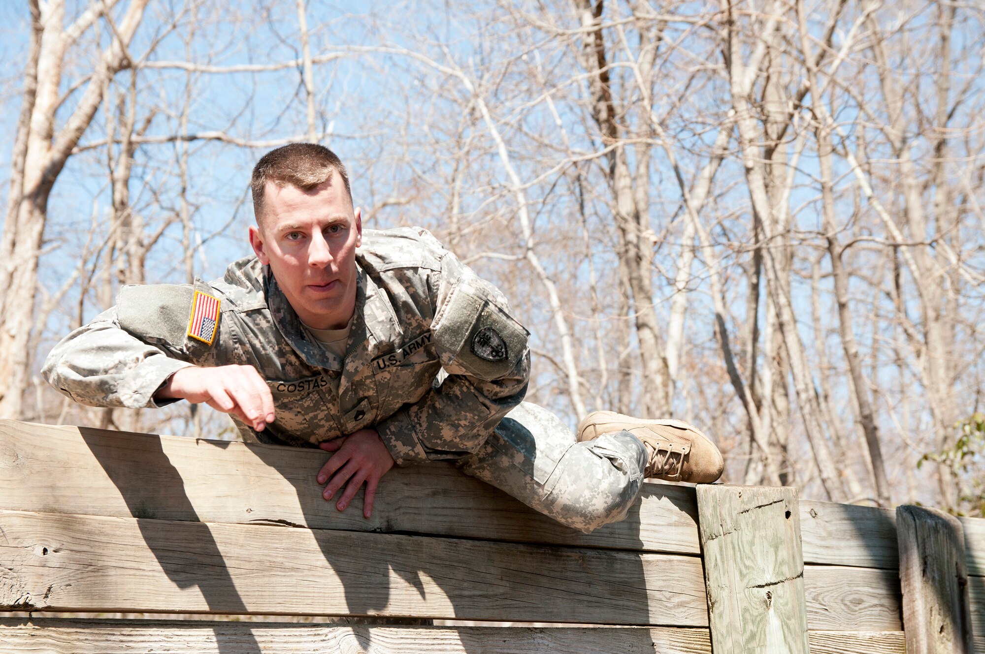 Army Reserve Staff Sgt. Jacob Costas, 28, a Military Police Soldier, works his way through the obstacle course during day two of the 200th Military Police Command???s Best Warrior Competition on April 1 at Joint Base McGuire-Dix-Lakehurst, N.J. Eight warfighters are competing in the weeklong competition held March 31 ??? April 3 in a variety of physical and mental events to earn the top spot of Best Warrior for Soldier and noncommissioned officer of the year. Costas is assigned to the 339th MP Company and from DeWitt, Iowa. The winners will compete at the Army Reserve Best Warrior Competition held in May. The 200th MPCOM is the largest Department of Defense law enforcement organization, with nearly 14,000 Soldiers living in 44 states. (Army Reserve photo by Sgt. Gina Russell/released)