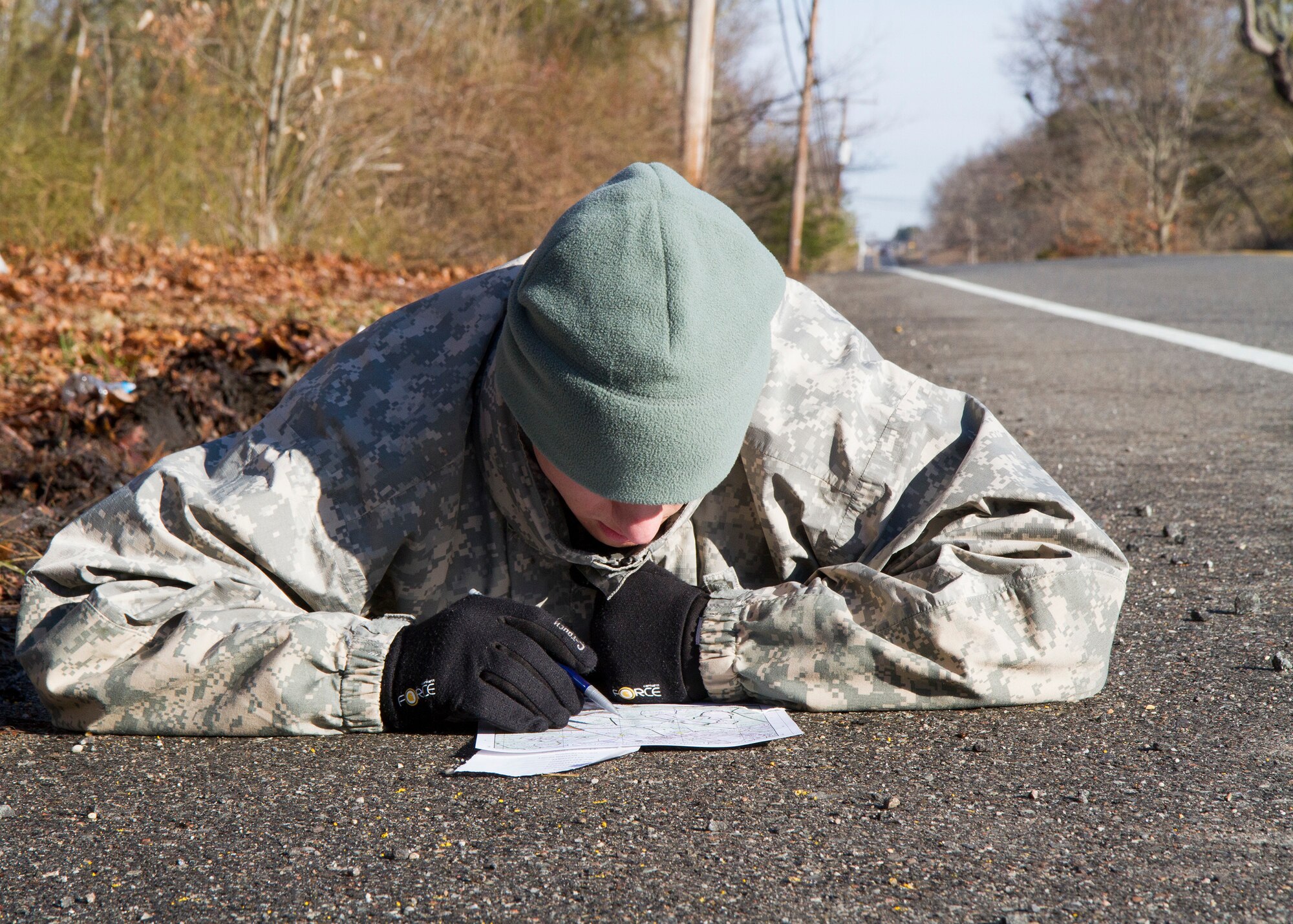 Army Reserve Spc. Chance Humbard, 21, from Waldorf, Mary., plots his distance points at the daytime navigation course during day two of the 200th Military Police Command???s Best Warrior Competition on March 31 at Joint Base McGuire-Dix-Lakehurst, N.J. Eight warfighters are competing in the weeklong competition held March 31-April 3 in a variety of physical and mental events to earn the top spot of Best Warrior for Soldier and noncommissioned officer of the year. Humbard is supply specialist assigned to Headquarters and Headquarters Company, 400th Military Police Battalion, based at Fort Meade, Maryland. The winners will compete at the Army Reserve Best Warrior Competition held in May. The 200th MPCOM is the largest Department of Defense law enforcement organization with nearly 14,000 Soldiers living in 44 states.  (Army Reserve photo by Sgt. 1st Class Mark Bell/released)