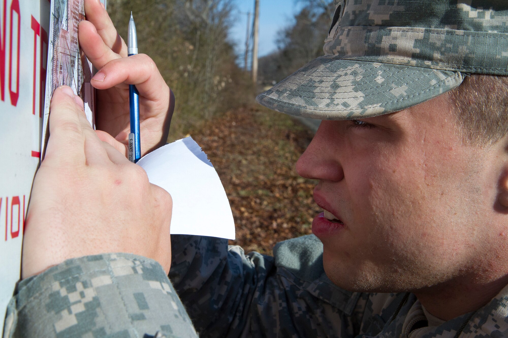 Army Reserve Spc. Kyle Coder, 20 from Murfreesboro, Tenn., plots his distance points at the daytime navigation course during day two of the 200th Military Police Command???s Best Warrior Competition on March 31 at Joint Base McGuire-Dix-Lakehurst, N.J. Eight warfighters are competing in the weeklong competition held March 31-April 3 in a variety of physical and mental events to earn the top spot of Best Warrior for Soldier and noncommissioned officer of the year. Coder is a Military Police Soldier assigned to the 450th MP Company. The winners will compete at the Army Reserve Best Warrior Competition held in May. The 200th MPCOM is the largest Department of Defense law enforcement organization with nearly 14,000 Soldiers living in 44 states. (Army Reserve photo by Sgt. 1st Class Mark Bell/released)