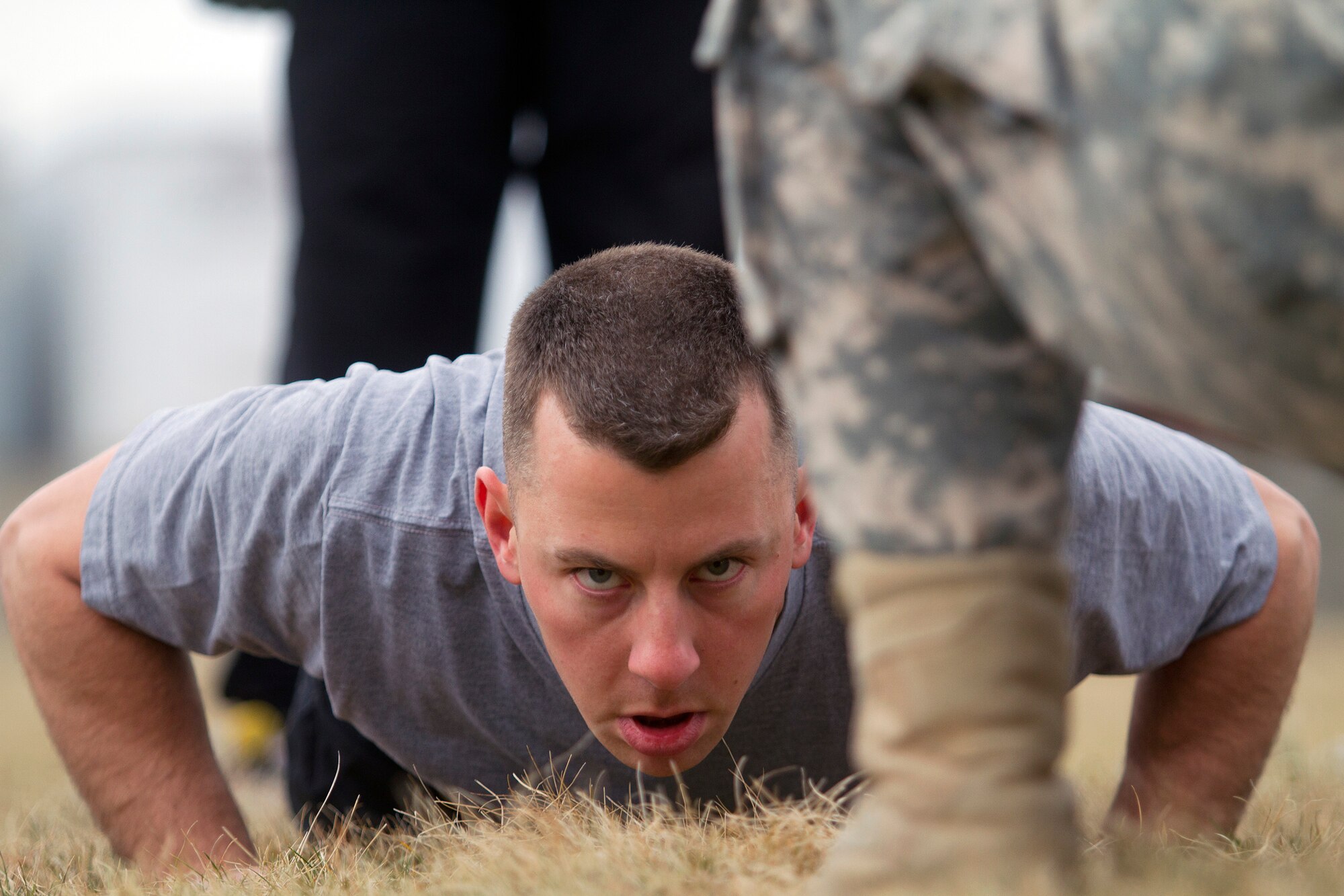 Army Reserve Staff Sgt. Jacob Costas, 28, from DeWitt, Iowa, completes the push-up event during the Army Physical Fitness Test during day one of the 200th Military Police Command???s Best Warrior Competition on March 31 at Joint Base McGuire-Dix-Lakehurst, N.J. Eight warfighters are competing in the weeklong competition held March 31-April 3 in a variety of physical and mental events to earn the top spot of Best Warrior for Soldier and noncommissioned officer of the year. Costas is a Military Police Soldier assigned to the 339th MP Company. The winners will compete at the Army Reserve Best Warrior Competition held in May. The 200th MPCOM is the largest Department of Defense law enforcement organization with nearly 14,000 Soldiers living in 44 states. (Army Reserve photo by Sgt. 1st Class Mark Bell/released)