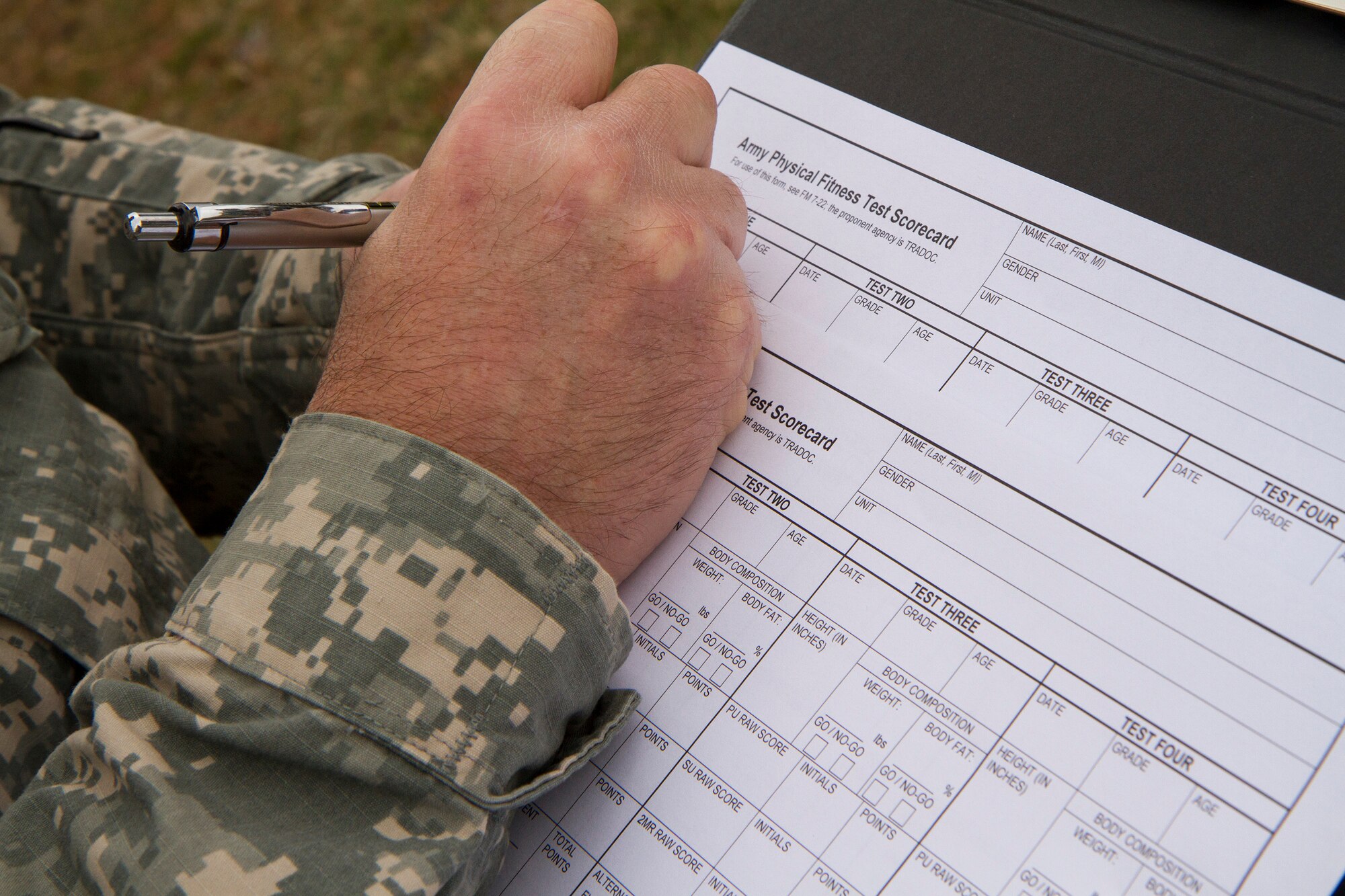 A Soldier fills out the Army Physical Fitness Test scorecard during day one of the 200th Military Police Command???s Best Warrior Competition on March 31 at Joint Base McGuire-Dix-Lakehurst, N.J. Eight warfighters are competing in the weeklong competition held March 31 ??? April 3 in a variety of physical and mental events to earn the top spot of Best Warrior for Soldier and noncommissioned officer of the year. The winners will compete at the Army Reserve Best Warrior Competition held in May. The 200th MPCOM is the largest Department of Defense law enforcement organization, with nearly 14,000 Soldiers living in 44 states. (Army Reserve photo by Sgt. 1st Class Mark Bell/released)