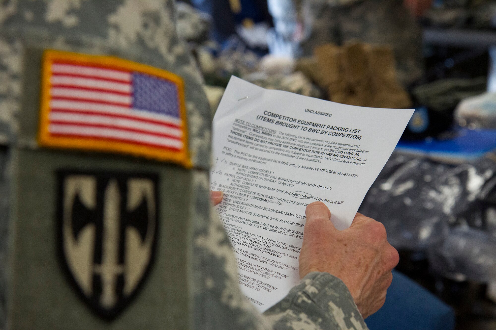 Sgt. 1st Class Marjorie Moorman reads the requirements of the packing list to warfighters competing in the 200th Military Police Command???s Best Warrior Competition during day one of the weeklong competition held at Joint Base McGuire-Dix-Lakehurst, N.J., March 31 ??? April 3. Eight competitors competed in a variety of physical and mental events to earn the top spot of Best Warrior for Soldier and noncommissioned officer of the year. Moorman is assigned to the Headquarters and Headquarters Company, 400th Military Police Battalion, based at Fort Meade, Md. The winners will compete at the Army Reserve Best Warrior Competition held in May. The 200th MPCOM is the largest Department of Defense law enforcement organization, with nearly 14,000 Soldiers living in 44 states. (Army Reserve photo by Sgt. 1st Class Mark Bell/released)