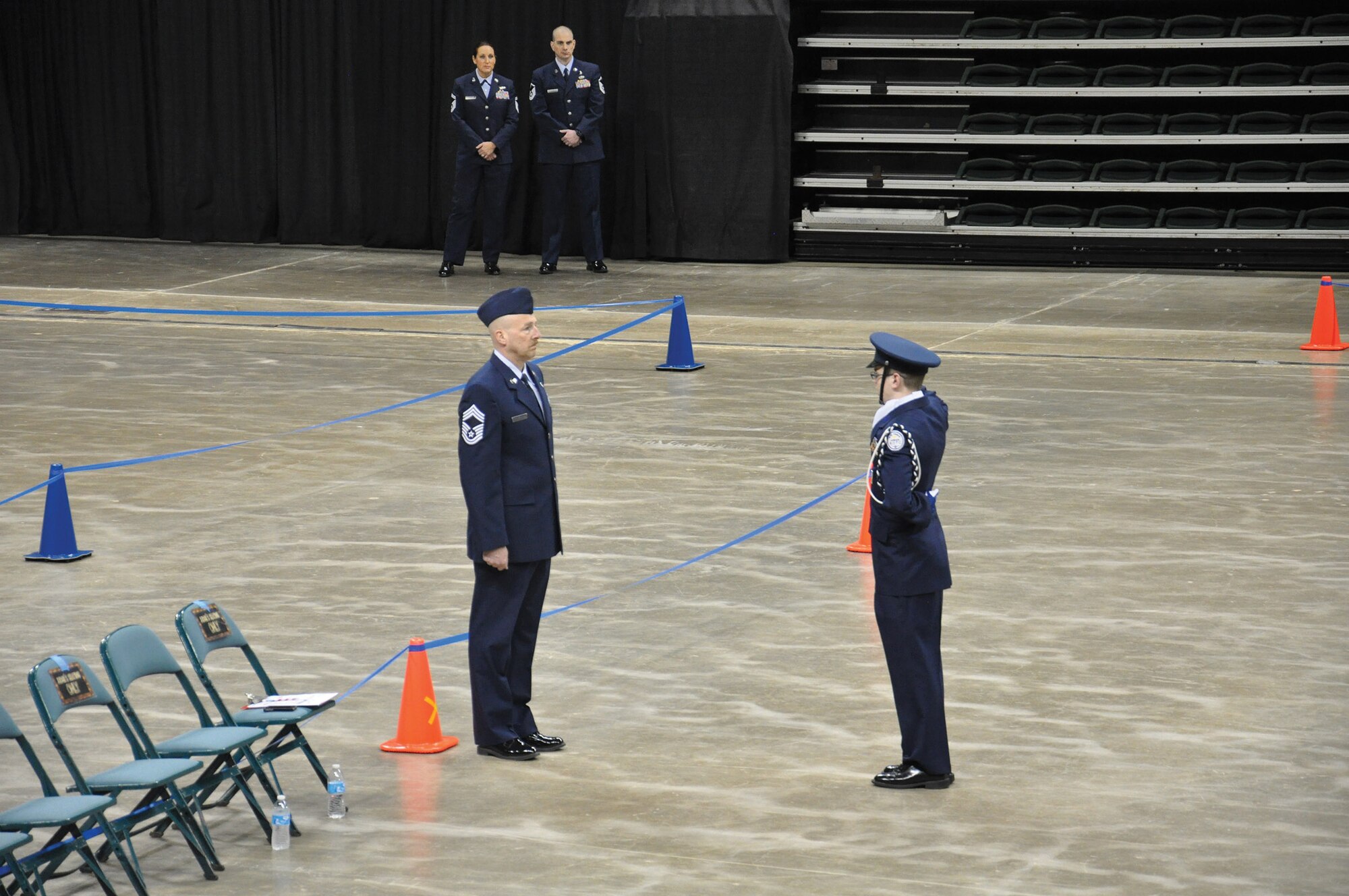 Fairborn, Ohio-- Chief Master Sgt. Mark Lockhart, 445th Maintenance Group superintendent, serves as a judge during the 2015 Air Force Junior ROTC National Drill Competition at the Wright State University Nutter Center here March 21, 2015. (U.S. Air Force photo/Maj. Demetrius Smith).