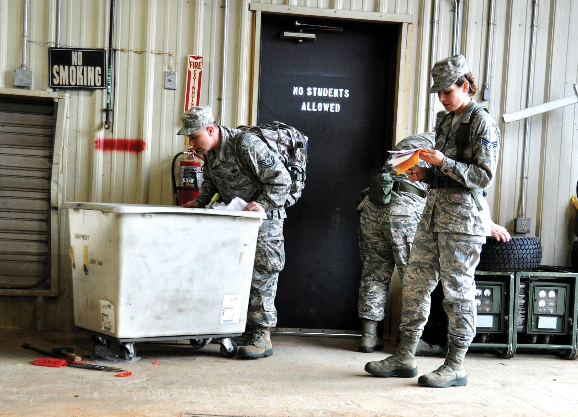 DOBBINS AIR RESERVE BASE, Ga. - Senior Airman Jessica McMillan, Tech. Sgt. Harold Debolt and Staff Sgt. Alison Barnes, all from the 445th Force Support Squadron at Wright Patterson Air Force Base, Ohio, Look for the next clue during the scavenger hunt portion of the Readiness Challenge for Force Support Silver Flag at Dobbins Air Reserve Base, Georgia, March 12, 2015. Silver Flag participants had to race through numerous obstacles and puzzles during the portion on the challenge. (U.S. Air Force photo/Senior Airman Daniel Phelps)