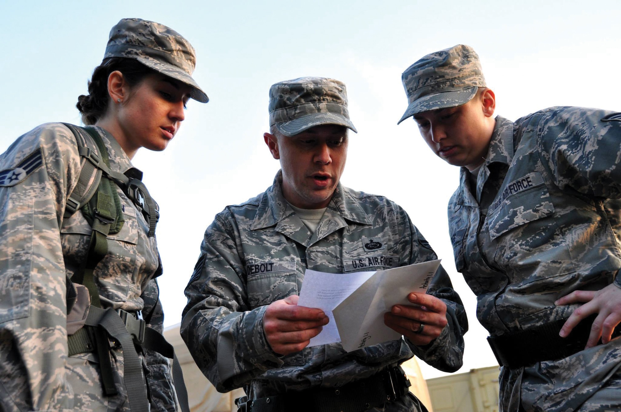 DOBBINS AIR RESERVE BASE, Ga. - Senior Airman Jessica McMillan, Tech. Sgt. Harold Debolt and Staff Sgt. Alison Barnes, 445th Force Support Squadron PERSCO team, review a clue for the scavenger hunt portion of the Readiness Challenge for Force Support Silver Flag at Dobbins Air Reserve Base, Georgia, March 12, 2015. Silver Flag participants had to race through numerous obstacles and puzzles during the portion on the challenge. (U.S. Air Force photo/Senior Airman Daniel Phelps)