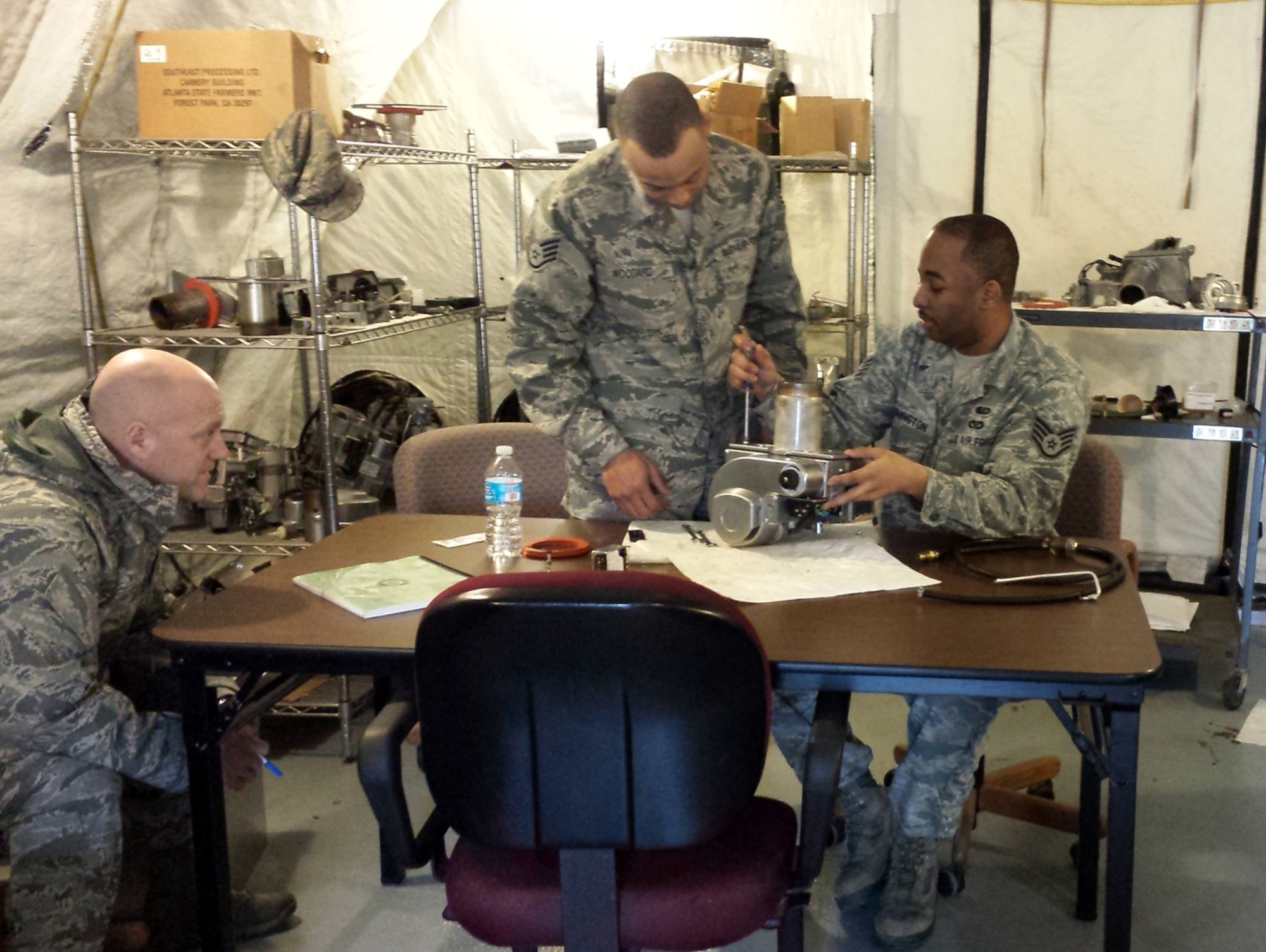 DOBBINS AIR RESERVE BASE, Ga. - 445th Force Support Squadron services flight Airmen Staff Sgt. Gerald Woodard and Staff Sgt. Cordell Washington had to disassemble, reassemble and ignite for a minimum of 30 seconds a Babington Burner against another two-person team during the 2015 Air Force Reserve Command Force Support Silver Flag Competition held March 10-12, 2015. The two teams competed to see who could take apart and put back their burner together in working condition the fastest. (U.S. Air Force photo/Senior Master Sgt. Jim Highland)