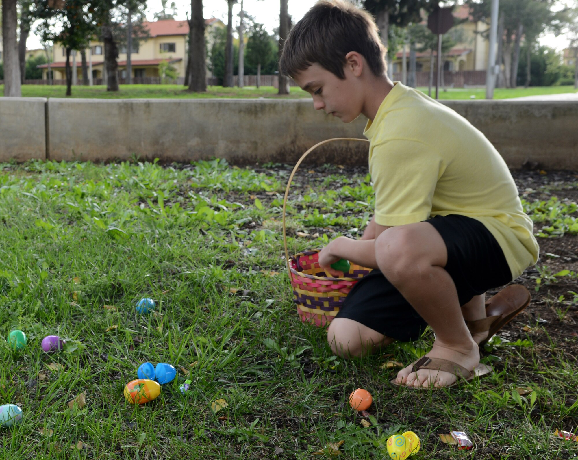 Austin Flora, son of Master Sgt. Andrew Flora, 39th Logistics Readiness Squadron first sergeant, collects Easter eggs April 5, 2015, at Incirlik Air Base, Turkey. More than 100 members of Team Incirlik attended the event hosted by the base chapel. (U.S. Air Force photo by Staff Sgt. Caleb Pierce/Released) 