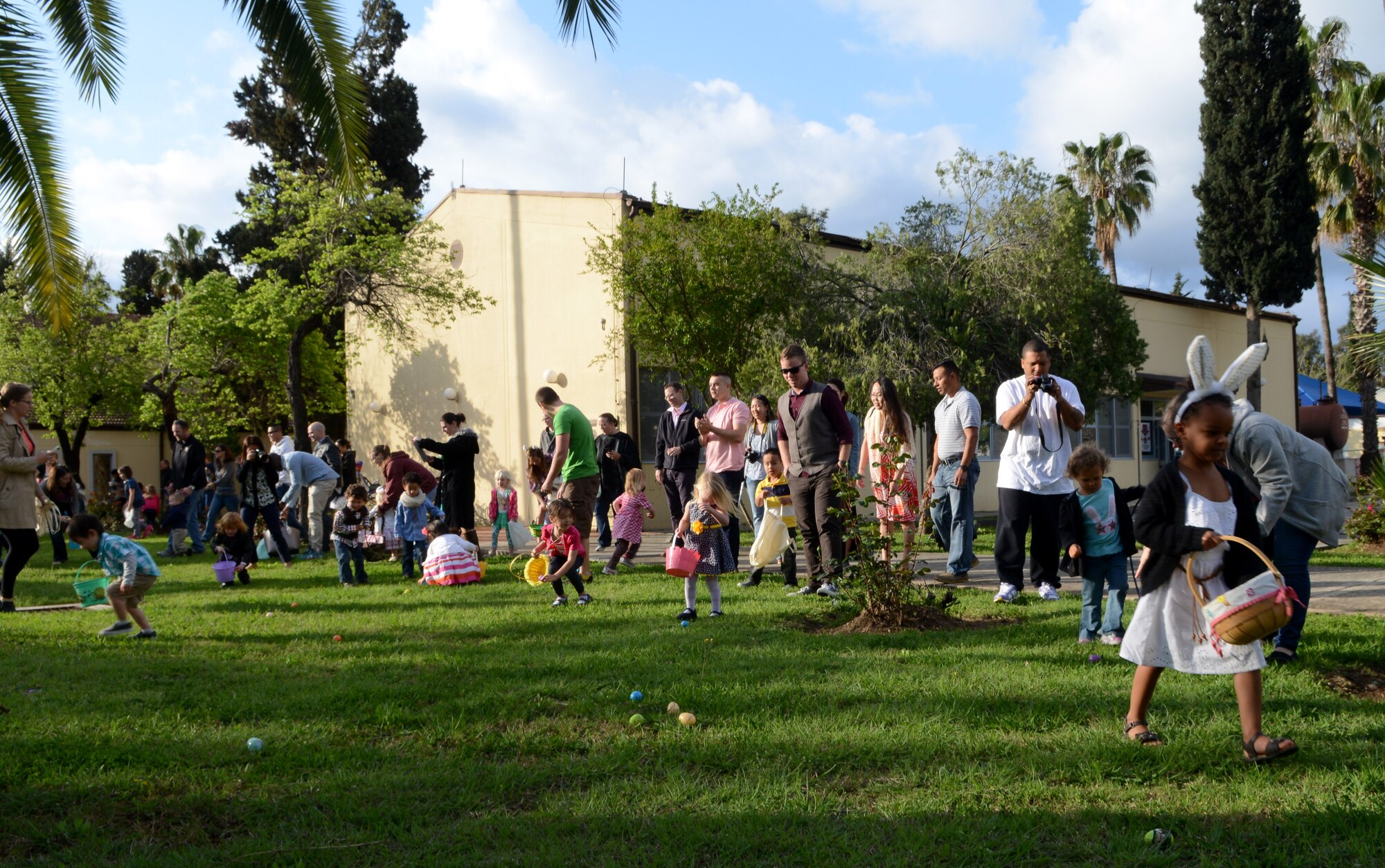 Children search for Easter eggs April 5, 2015, at Incirlik Air Base, Turkey. The base chapel placed 500 Easter eggs for the children to find. (U.S. Air Force photo by Staff Sgt. Caleb Pierce/Released)