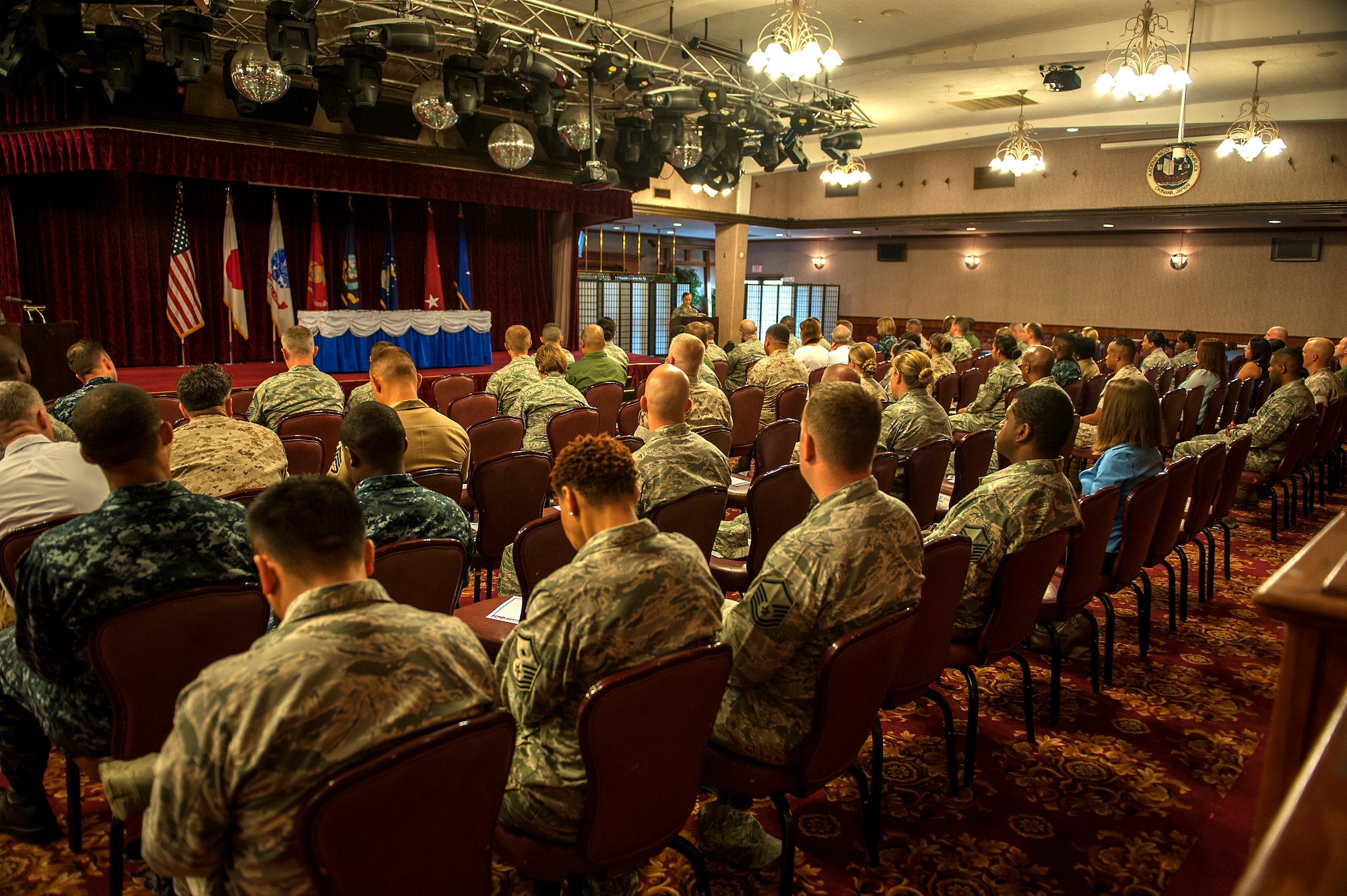 Attendees of the 2015 Sexual Assault Prevention and Response month proclamation signing listen as U.S. Air Force Capt. Elizabeth Belleau, 18th Wing sexual assault response coordinator, talks about SAPR month and the role it plays in military lives at the Rocker NCO club on Kadena Air Base, Japan, April 7, 2015. During SAPR month, the 18th Wing sexual assault response coordinator’s office has several events planned to help raise awareness about sexual assault in the Armed Forces. (U.S. Air Force Photo by Airman 1st Class Stephen G. Eigel)