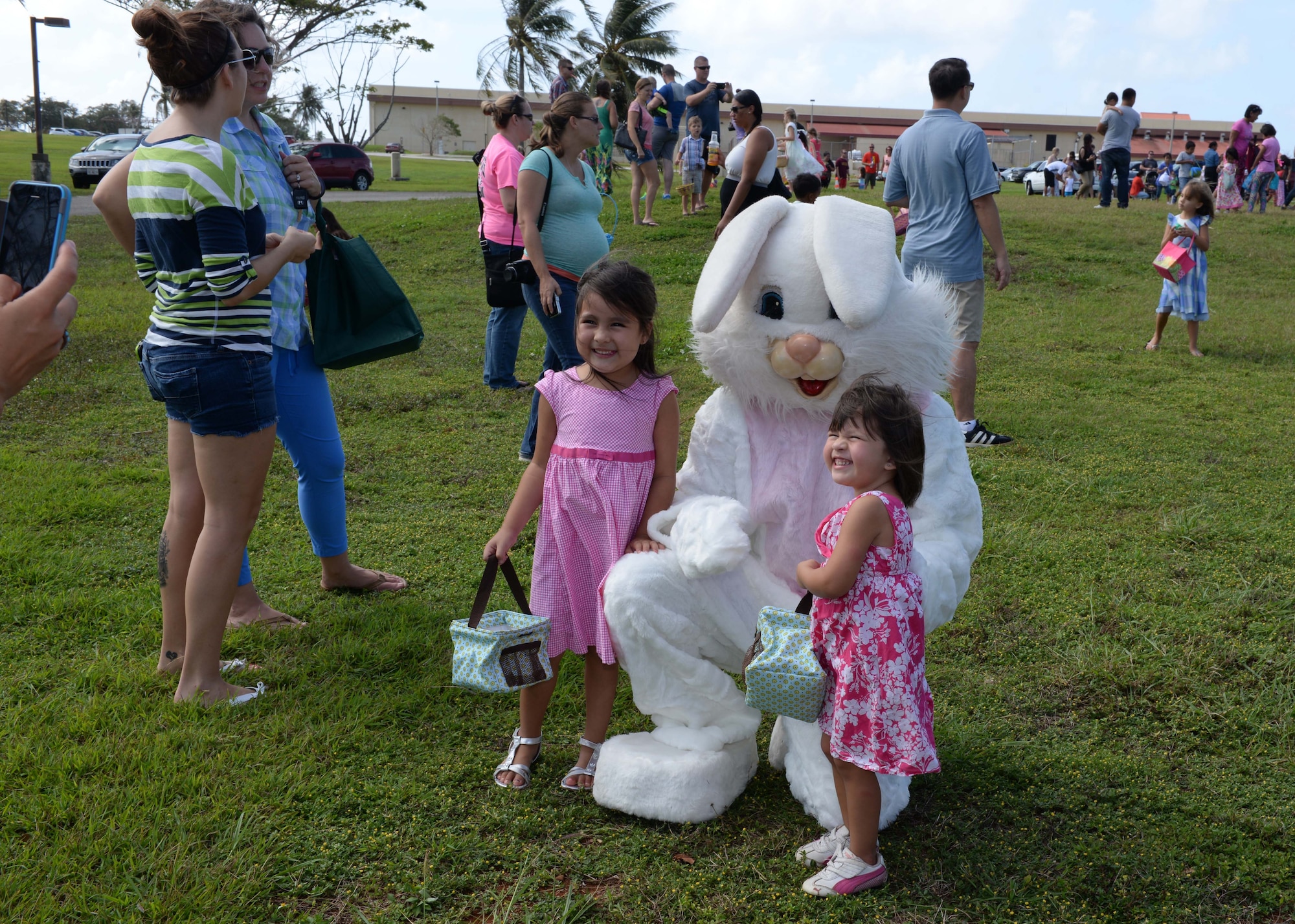 Children pose with the Easter bunny during an Easter egg hunt April 4, 2015, at Arc Light Memorial Park on Andersen Air Force Base, Guam. The event, which used approximately 7,000 eggs, was sponsored by a host of base agencies and drew more than 650 children. (U.S. Air Force photo by Senior Airman Cierra Presentado/Released)