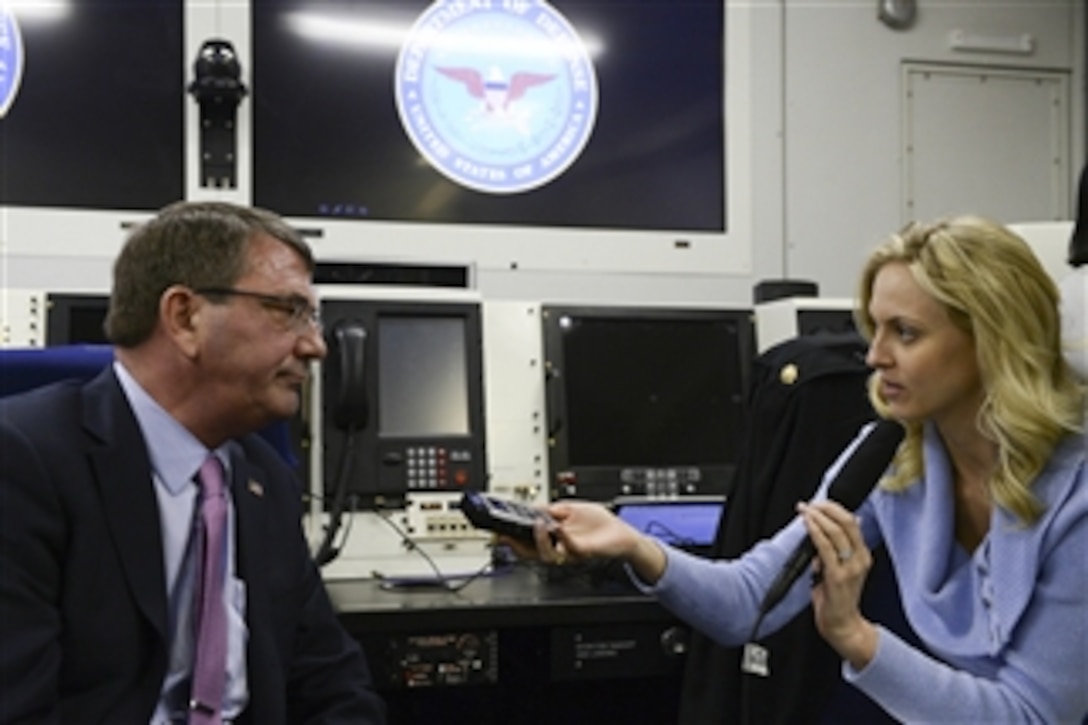 Defense Secretary Ash Carter briefs members of the press aboard an E-4B jet en route to Japan, April 6, 2015. Carter is on a visit to the U.S. Pacific Command Area of Responsibility to make observations for the future force and the military’s shift to the Pacific.