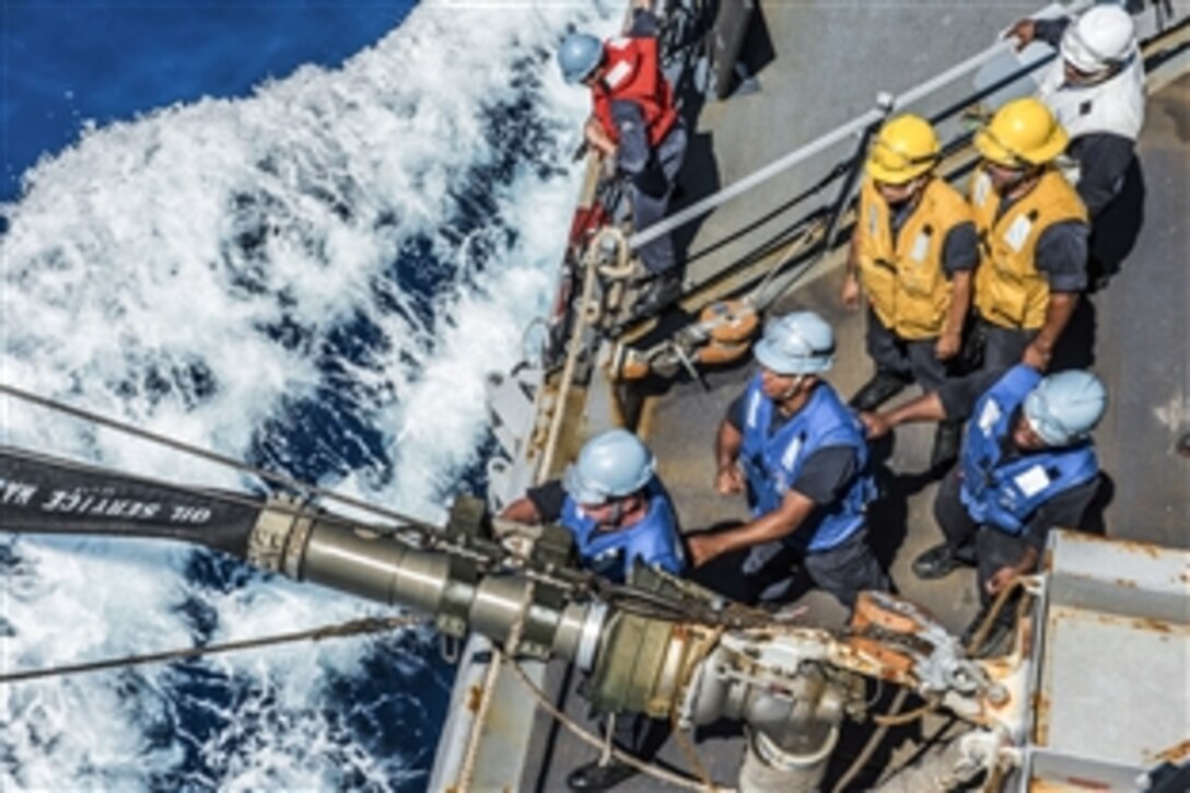 U.S. Navy sailors on the guided-missile destroyer USS Fitzgerald connect a fuel probe from the Military Sealift Command fleet replenishment oiler USNS Pecos during a replenishment in the South China Sea, April 5, 2015. The Fitzgerald is on patrol in the U.S. 7th Fleet area of responsibility supporting security and stability in the Indo-Asia-Pacific region. 