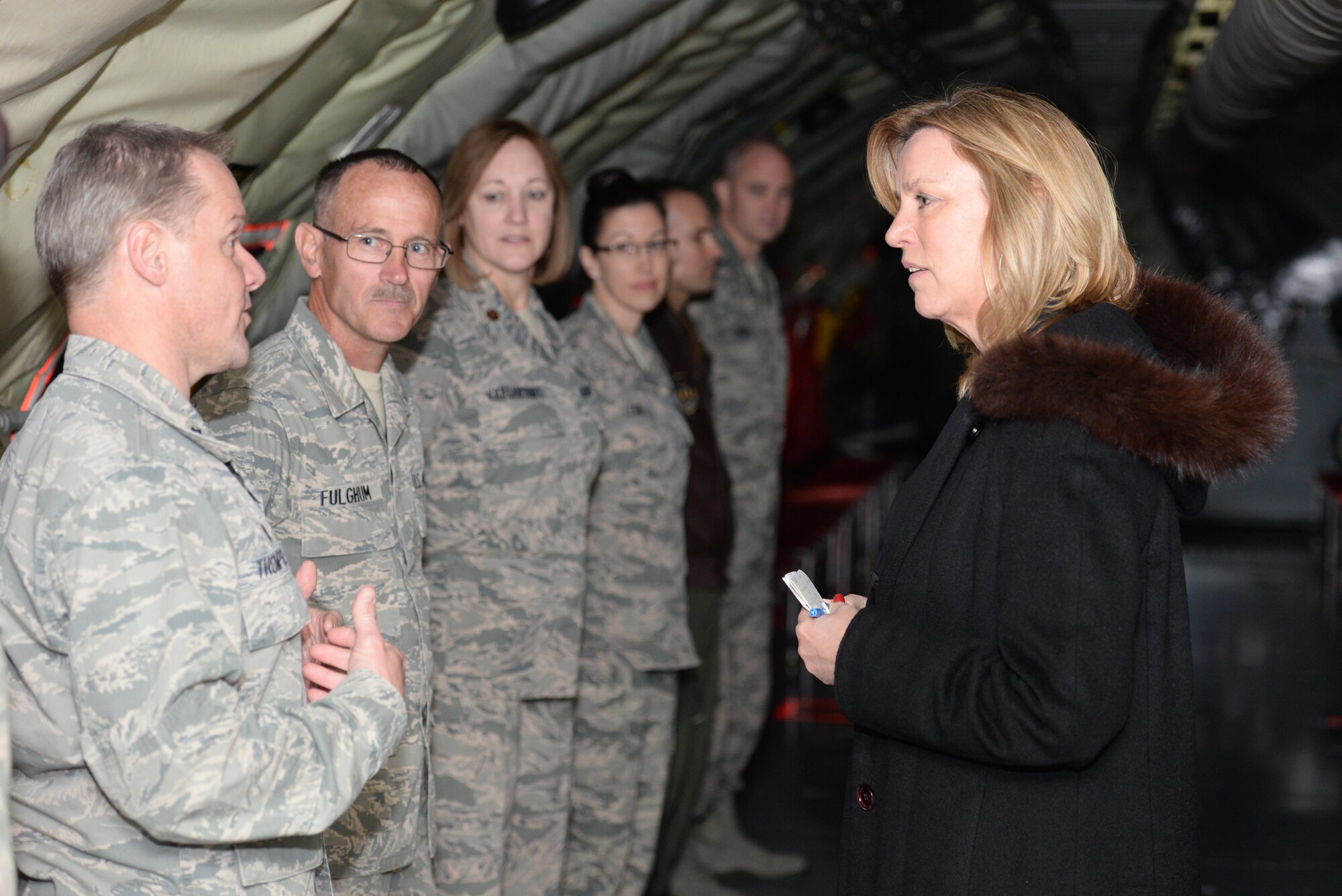 Lt. Col. Robert Thompson introduces Tech. Sgt. Harold Fulghum, both of the 507th Maintenance Squadron to the Secretary of the Air Force Deborah Lee James during the secretary's visit here March 27. Reserve Airmen briefed the secretary about various issues affecting the reserve component inside a KC-135R Stratotanker during her visit to the 507th Air Refueling Wing. (U.S. Air Force Photo/Staff Sgt. Caleb Wanzer) 
