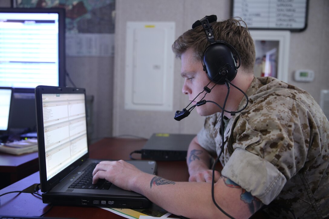 Lance Cpl. Sean Browning inputs information into a computer during Direct Air Support Center training inside a transient battle lab at Marine Corps Air Station Cherry Point, N.C., March 30, 2015. Browning is an air support operations operator and a native of Scottsburg, Ind. 