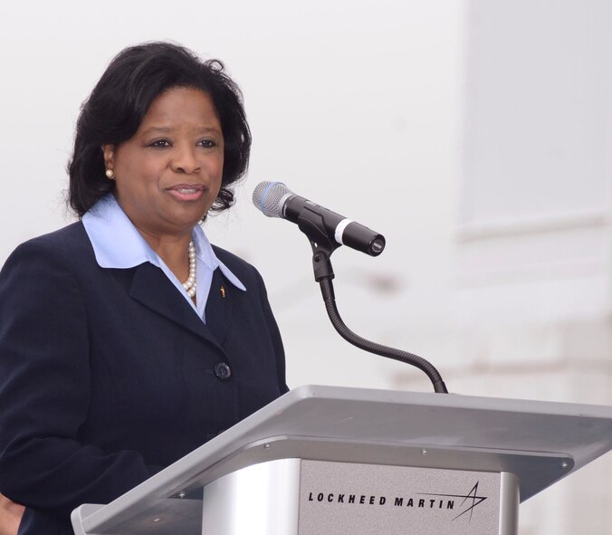 Shan Cooper, Lockheed Martin Vice President and General Manager,  speaks to an audience of company executives, military and civic leaders during a celebration of 60 years of the existence of the C-130 at The Lockheed Martin Aeronautics Company located in Marietta, Ga. April 7, 2015. The C-130 Hercules primarily performs the tactical portion of the airlift mission. The aircraft is capable of operating from rough, dirt strips and is the prime transport for airdropping troops and equipment into hostile areas. (U.S. Air Force photo/Don Peek)