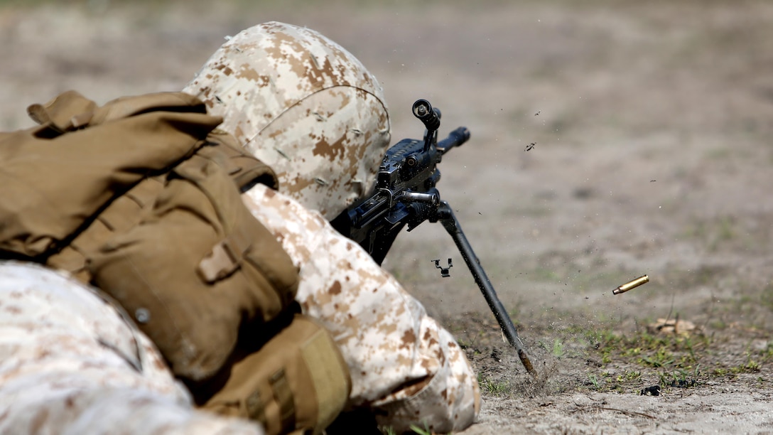Private First Class Mitchell Coyle, a mortarman with Scout Sniper Platoon, 1st Battalion, 2nd Marine Regiment, fires an M249 Squad Automatic Weapon during the Table 1 Machine Gun Qualification aboard Camp Lejeune, April 6, 2015. The platoon executed a combined machine gun and sniper rifle range, with the Marines getting valuable experience on both weapon systems. Machine gunners play an integral role in the scout sniper platoons, and it is imperative each Marine in the platoon has a working understanding of how they operate.