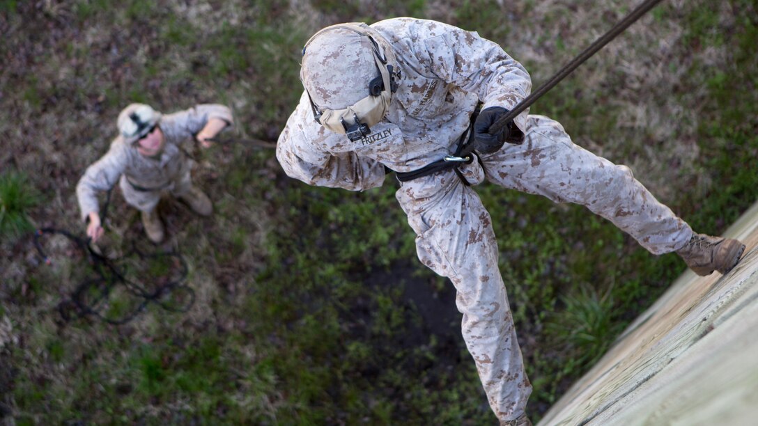 Lance Cpl. Benjamin Friztley, an infantryman with Golf Company, 2nd Battalion, 2nd Marine Regiment, descends down the rappel tower aboard Camp Lejeune, North Carolina, April 2, 2015. The Marines executed the rappel tower to build individual and unit confidence in preparation for their next deployment.