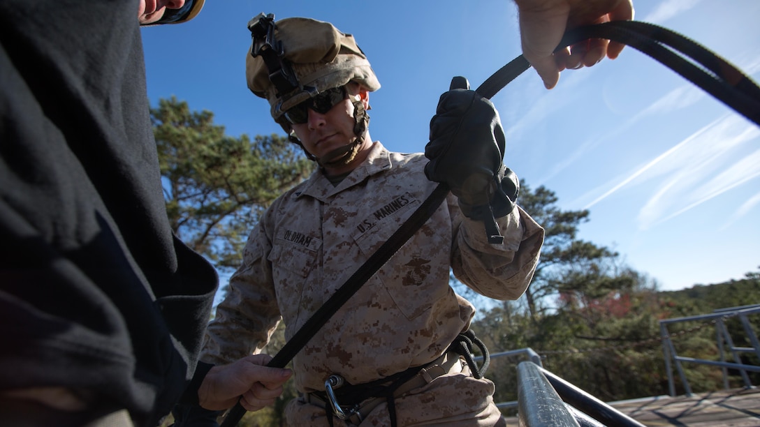 Lance Cpl. Adam Oldham, an infantryman with Golf Company, 2nd Battalion, 2nd Marine Regiment, prepares to rappel off the rappel tower aboard Camp Lejeune, North Carolina, April 2, 2015. The rappel tower was one of the unit’s final exercises as part of their individual training package, designed to increase their operability in preparation for their next deployment. 