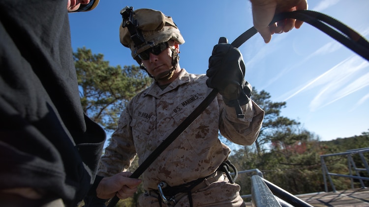 Lance Cpl. Adam Oldham, an infantryman with Golf Company, 2nd Battalion, 2nd Marine Regiment, prepares to rappel off the rappel tower aboard Camp Lejeune, North Carolina, April 2, 2015. The rappel tower was one of the unit’s final exercises as part of their individual training package, designed to increase their operability in preparation for their next deployment. 