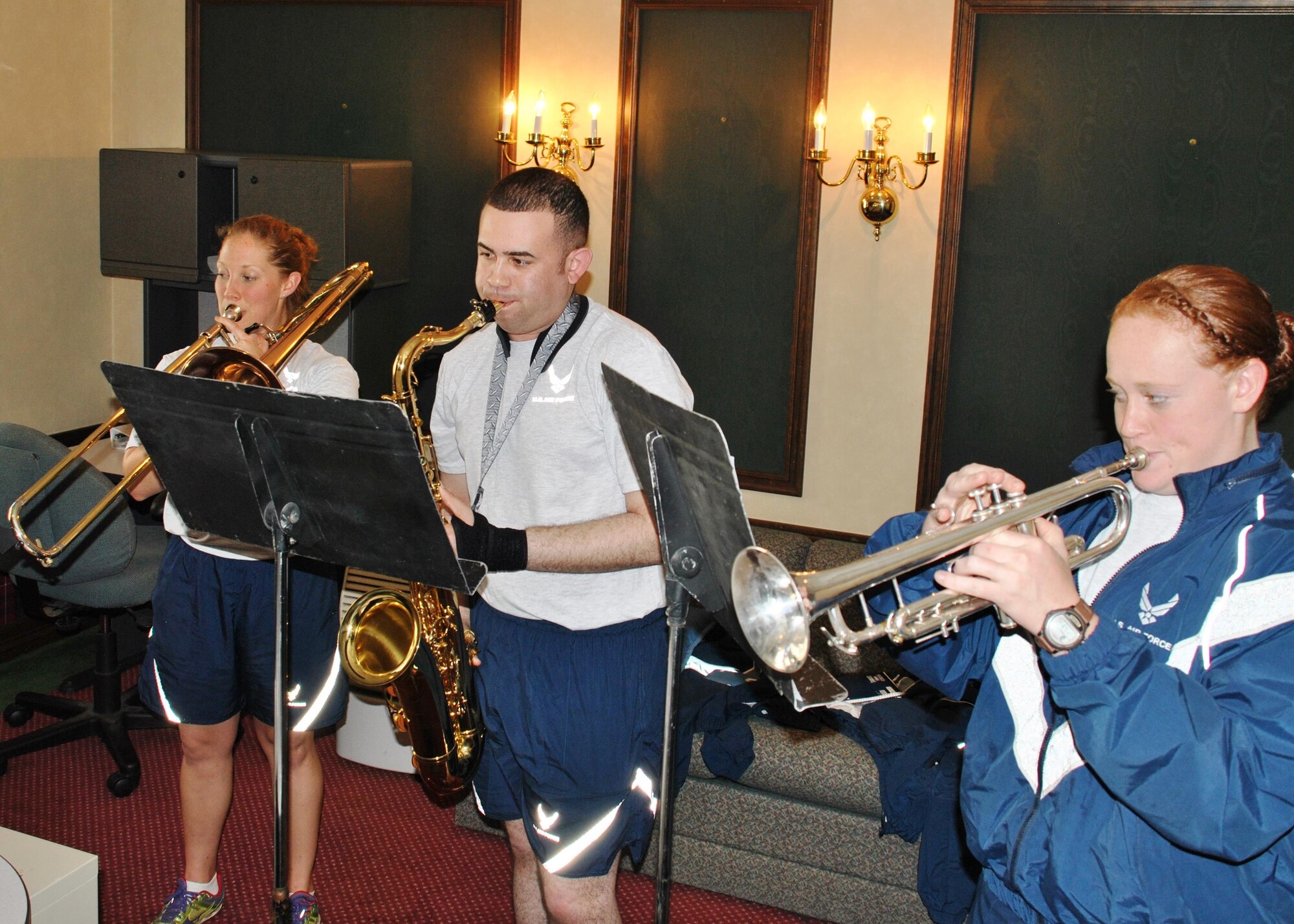 From left, Second Lt. Natalie Lane on the trumpet, Airman 1st Class Javier Rodriguez on the saxophone and Airman 1st Class Steffanee Davis on the trumpet run through some music during the second week of their two-month training period.