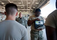 Staff Sgt. Timothy Gaulden, 58th Aircraft Maintenance Unit crew six load crew chief, center, briefs his team, Airmen 1st Class Jake Wiedmeyer and John St. Cyr, 58 AMU crew six load crew members, before loading munitions on to an F-35A Lightning II during a weapons load competition on Eglin Air Force Base, Florida, April 3, 2015. This was the 33rd Fighter Wing’s first weapons load competition since the 2009 draw down of the F-15C Eagle mission. (U.S. Air Force Photo/Staff Sgt. Marleah Robertson)