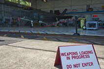 Airmen with the 58th Aircraft Maintenance Unit, crew one and crew six, compete in a weapons load competition on Eglin Air Force Base, Florida, April 3, 2015. This was the 33rd Fighter Wing’s first weapons load competition since the 2009 draw down of the F-15C Eagle mission and it determined the best F-35A Lightning II weapons load crew. During weapons load competitions, crews are evaluated on a uniform inspection, a written test, a quality assurance inspection of the teams’ tool kits and how safely, efficiently and timely they load munitions on an F-35A. (U.S. Air Force Photo/Staff Sgt. Marleah Robertson)
