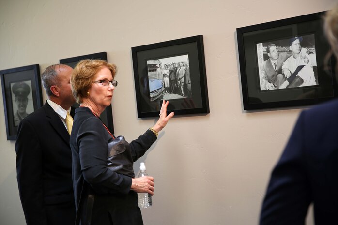 Maggie Coleman takes a closer look at photos of her late husband, Jerry Coleman, during a ceremony dedicating the Marine Corps Recruit Depot San Diego field house April 3. The ceremony paid tribute to Coleman’s military service, work with the Padres and his impact to the San Diego community. Coleman was a U.S Marine fighter pilot who flew over 120 combat missions in both World War II and the Korean War.