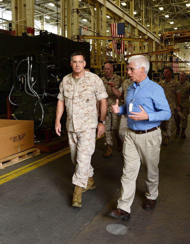 Maj. Gen. John Ewers, Staff Judge Advocate to the Commandant of the Marine
Corps, listens to Darren Jones, Marine Depot Maintenance Command/Production Plant Albany plant manager, explain the maintenance processes. Ewers toured MCLB Albany April 6.
