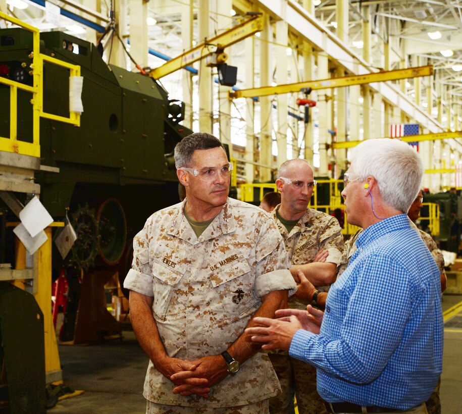 Maj. Gen. John Ewers, Staff Judge Advocate to the Commandant of the Marine
Corps, listens to Darren Jones, Marine Depot Maintenance Command/Production Plant Albany plant manager, explain the maintenance processes. Ewers toured MCLB Albany April 6.